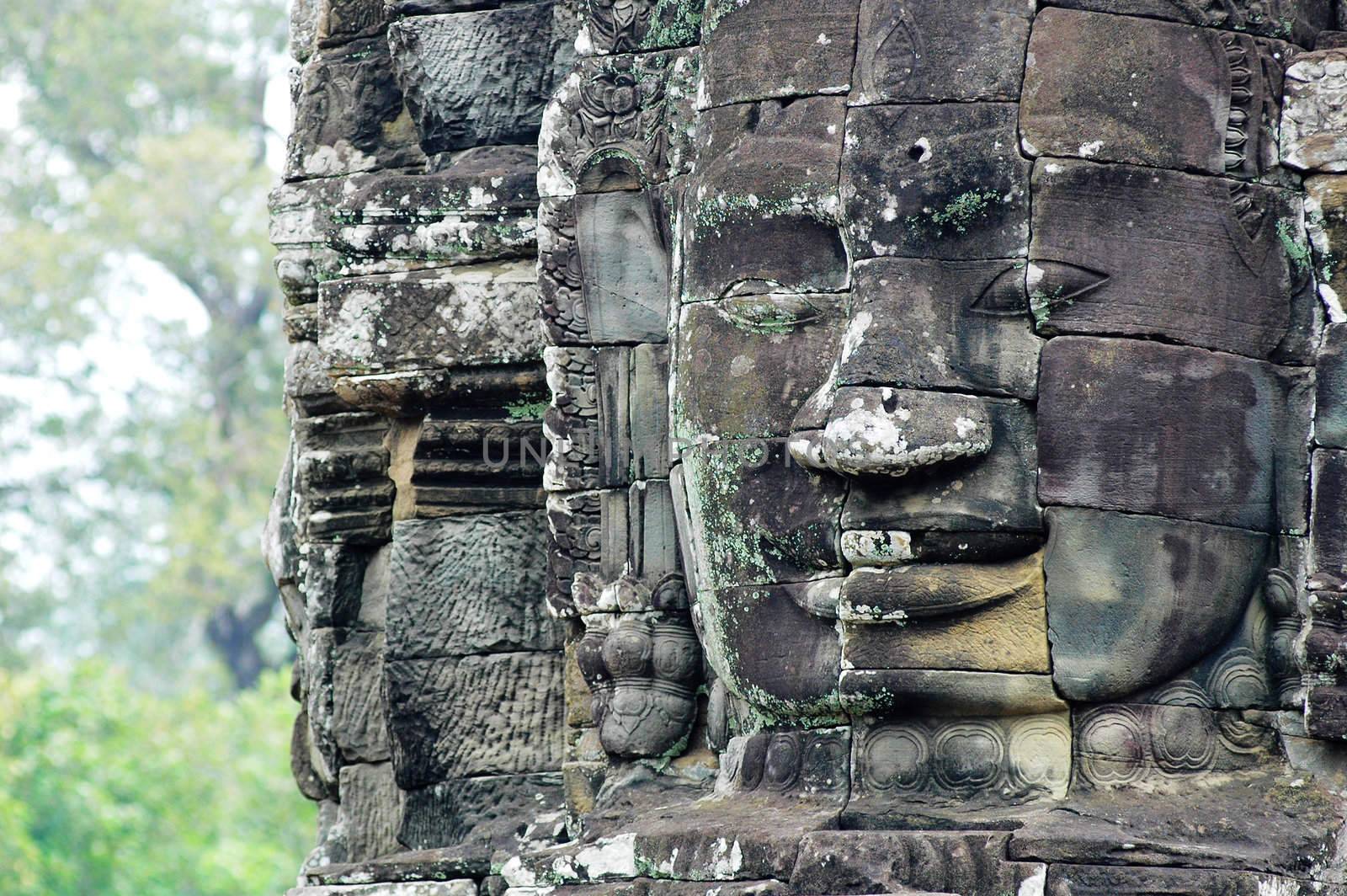 Giant ancient buddha rock statue at Angkor Cambodia