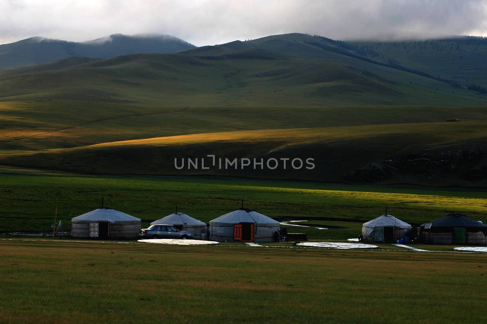 Landscape of gers at the foot of mountains in Mongolia