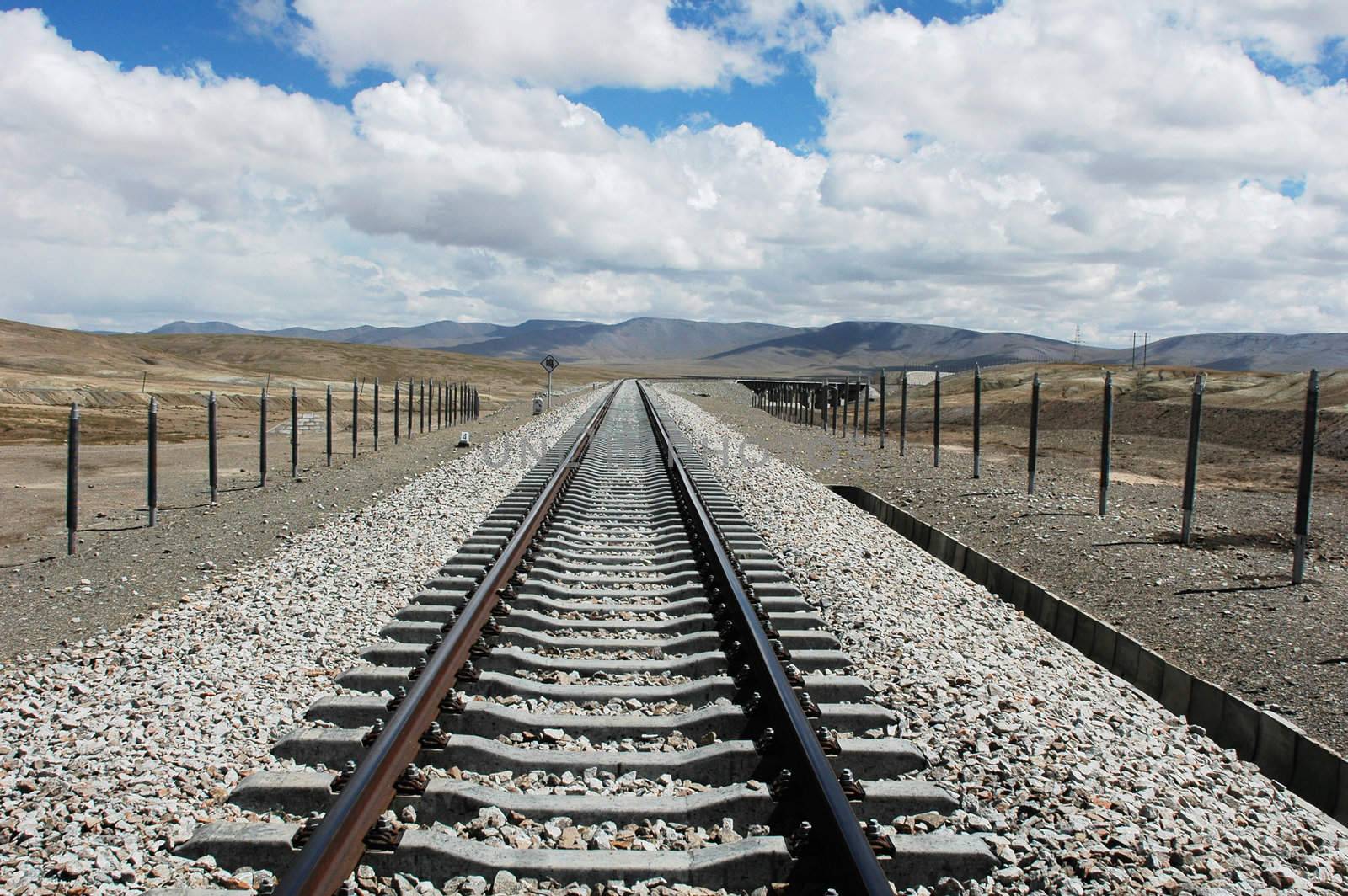 Railroad tracks extending to the distant in Tibet