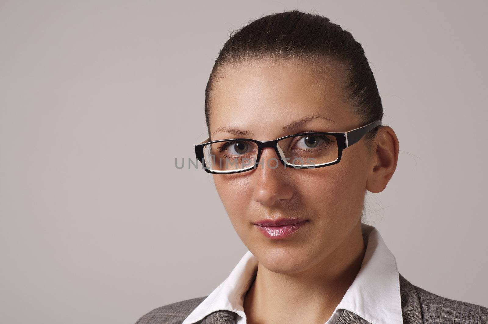 portrait of young business woman in the glasses by adam121