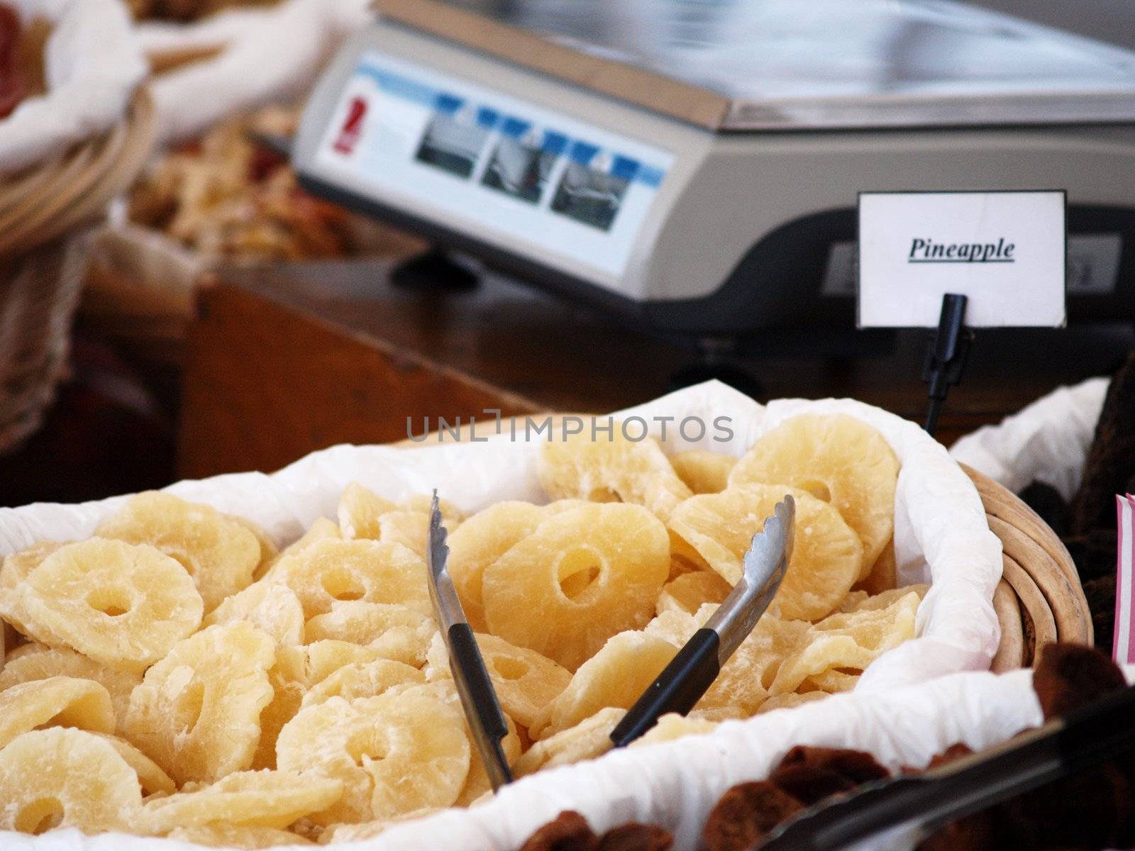 Dry pineapple fruit in basket, at market