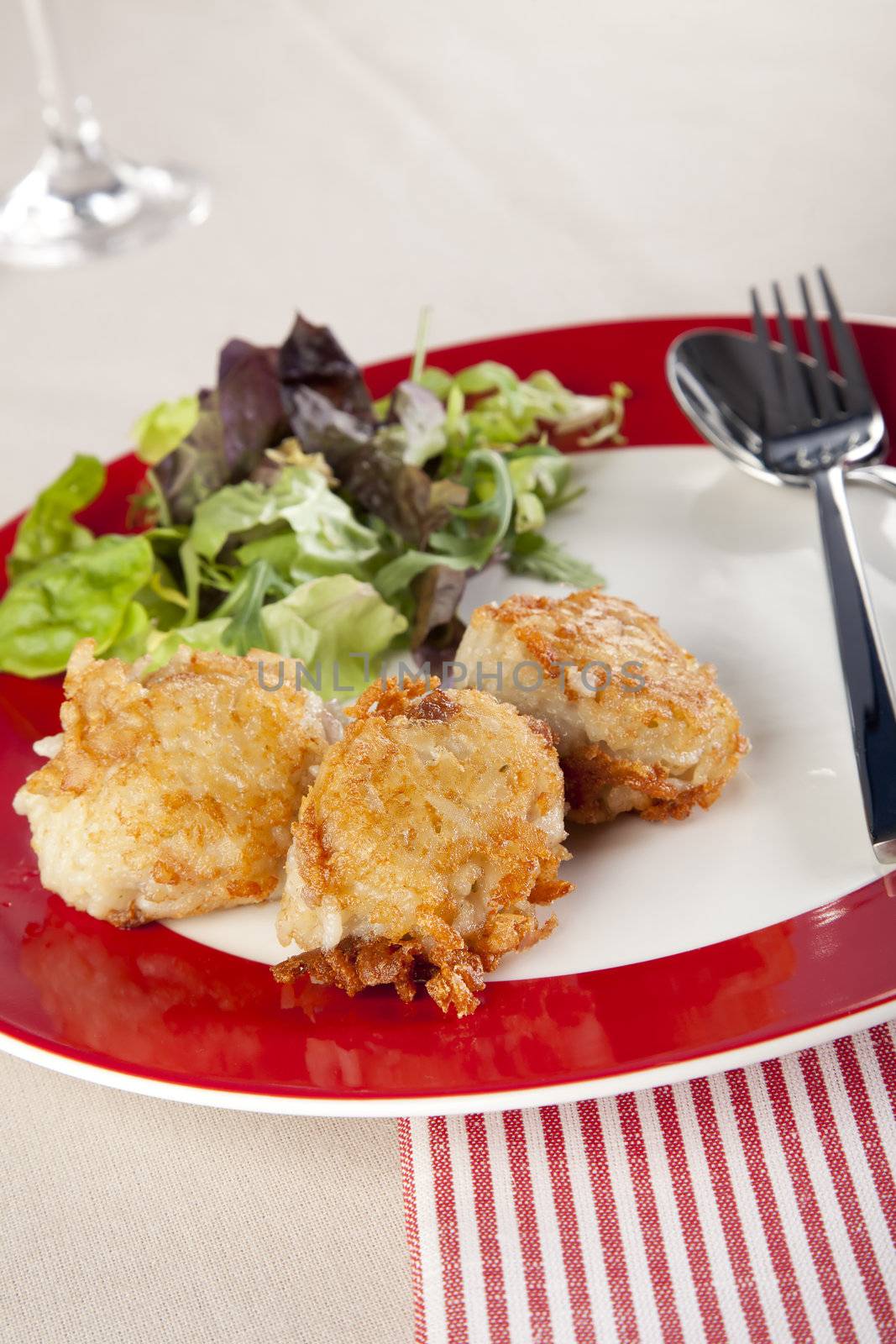 Risotto balls with a side salad.