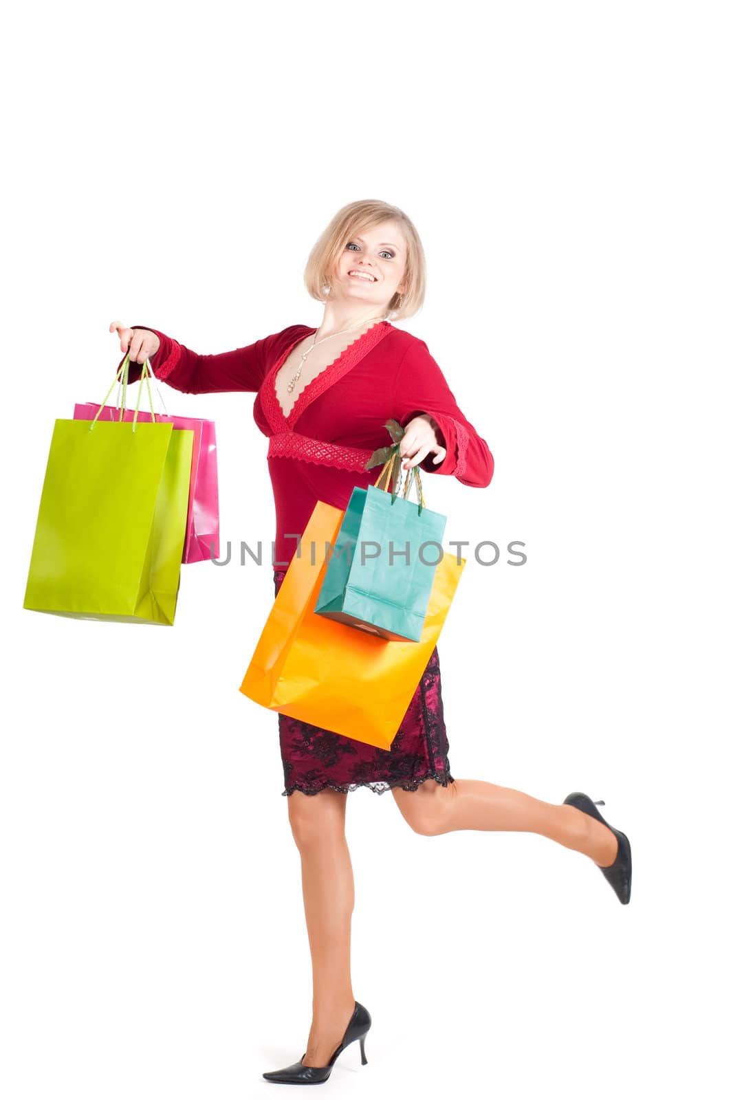 Beautiful woman with shopping bags isolated onwhite