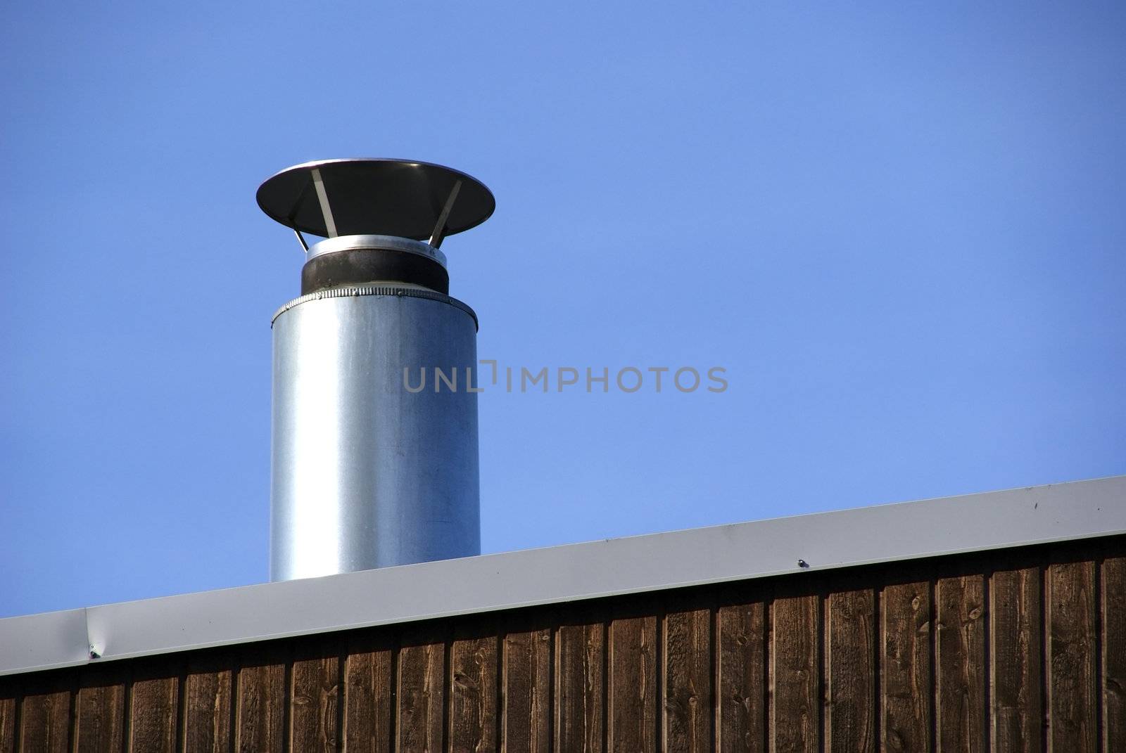 Pipe of ventilation are located on a roof of a  building