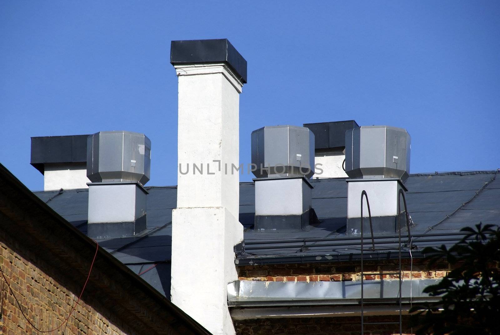 The roof and chimney with blue sky