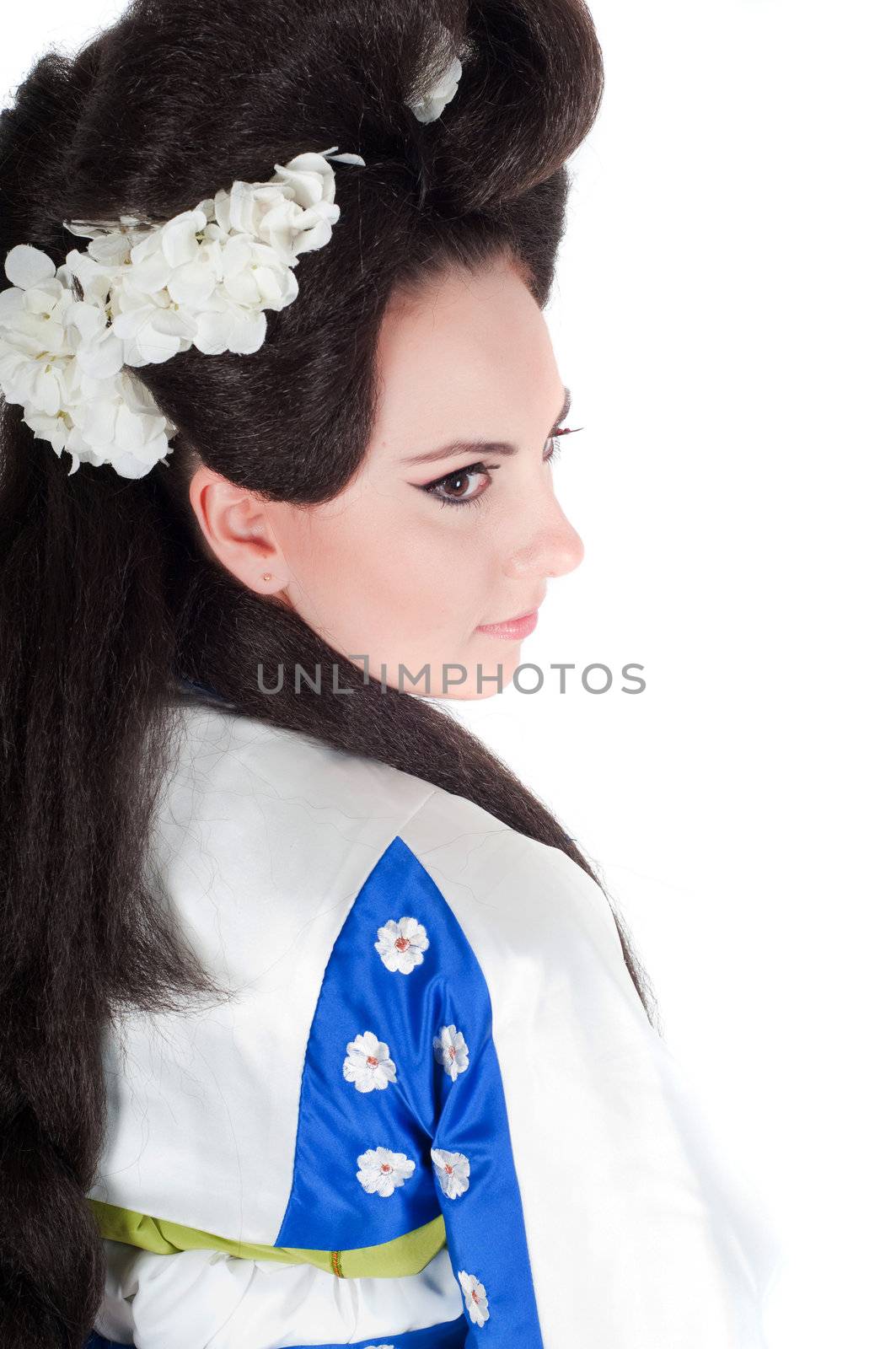 Portrait of the girl of the Asian appearance with a make-up under the geisha on a white background