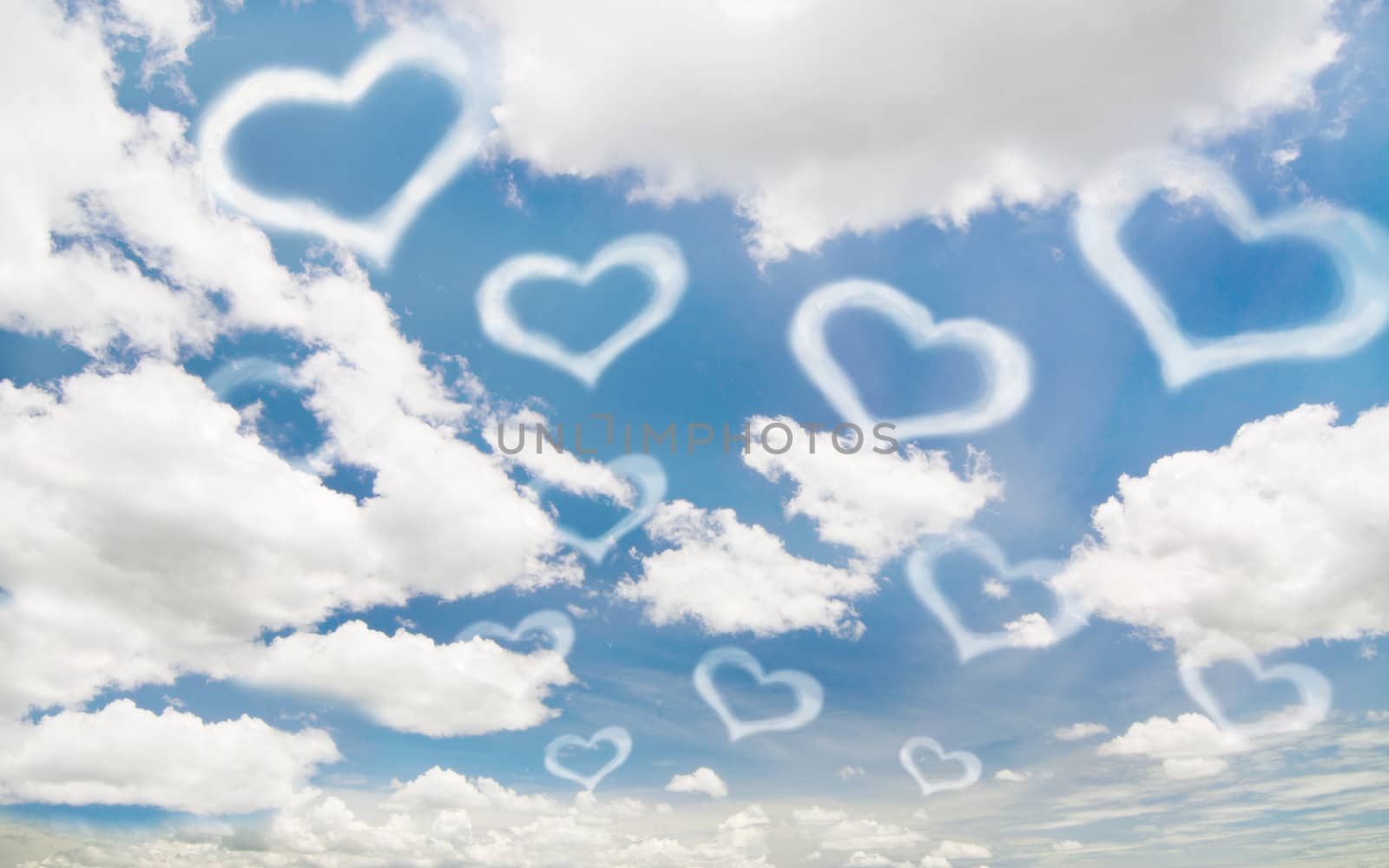 white heart on the blue sky and cloudy