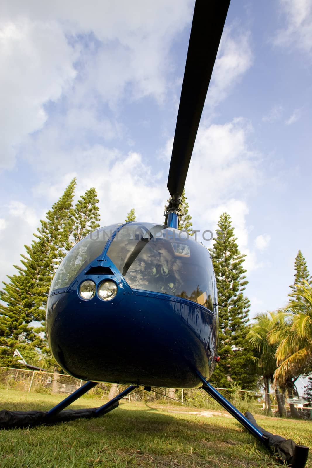 Helicopter R44 landed in a backyard.