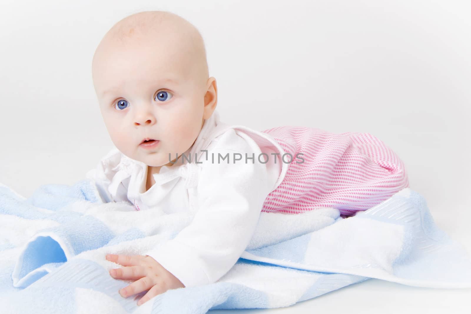baby girl in the studio on the floor
