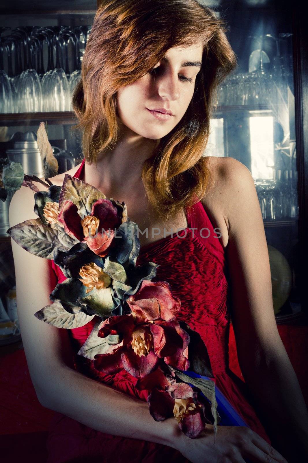 View of a beautiful young girl in a red dress on a living room.