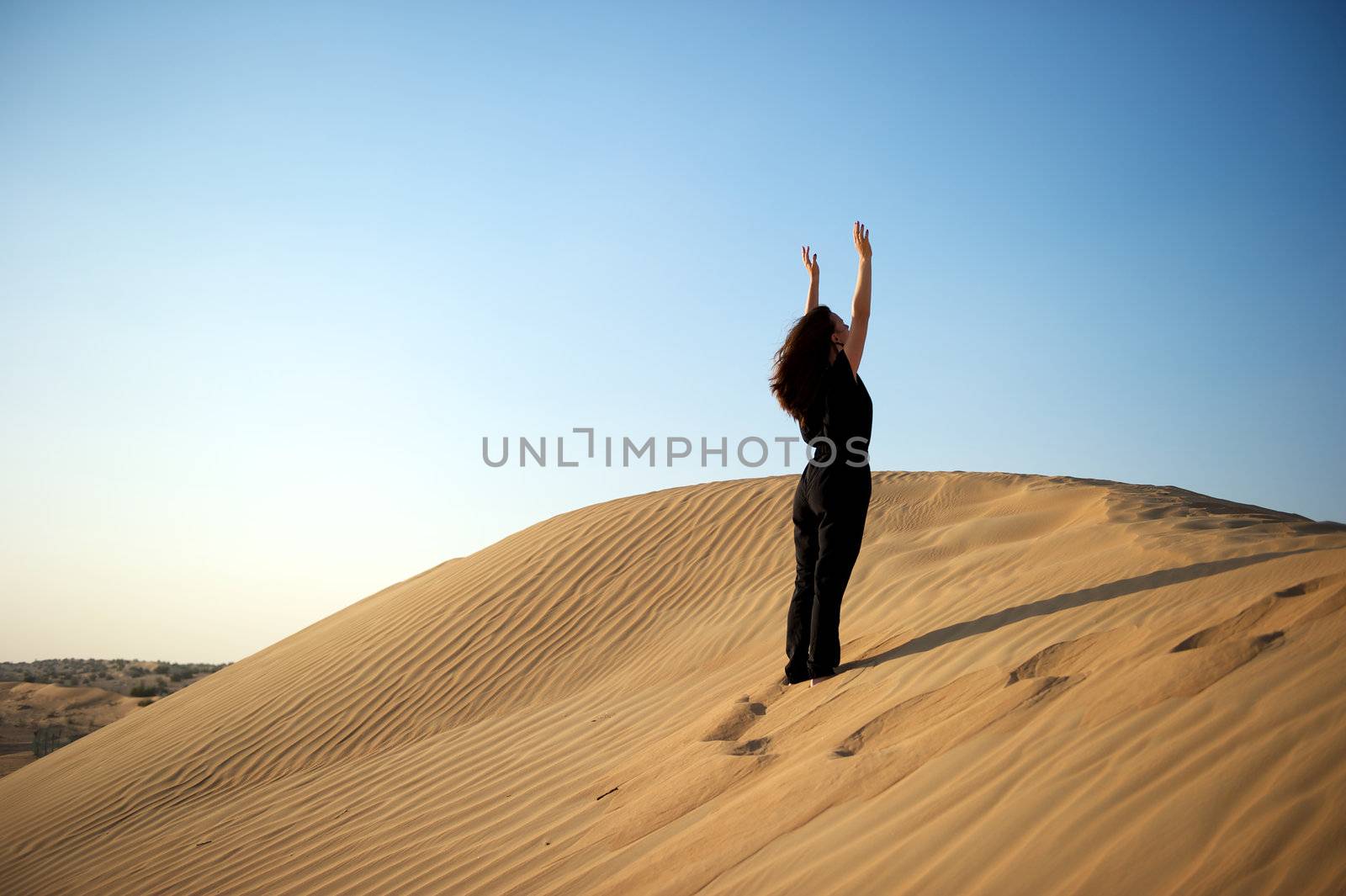 Woman enjoying the desert in Dubai, United Arab Emirates