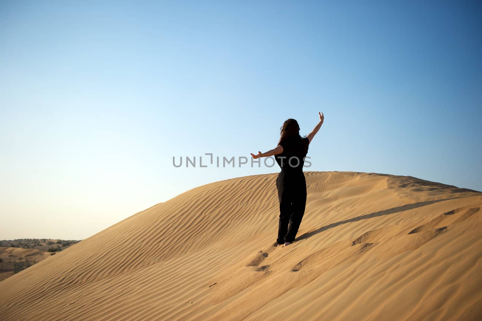 Woman enjoying the desert in Dubai, United Arab Emirates