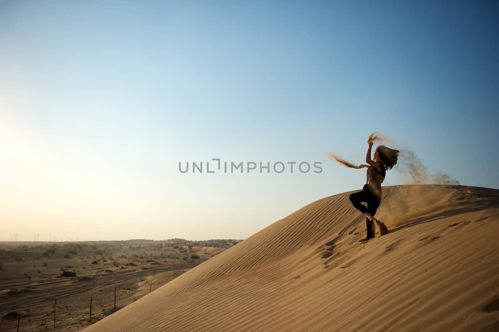 Woman enjoying the desert in Dubai, United Arab Emirates