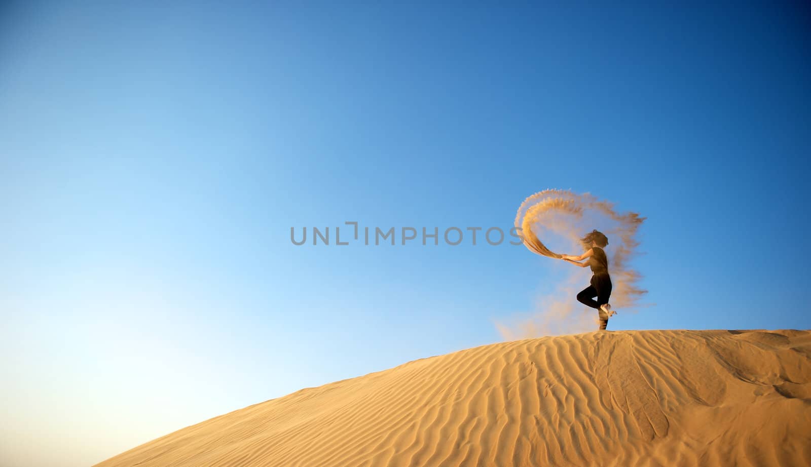 Woman enjoying the desert in Dubai, United Arab Emirates