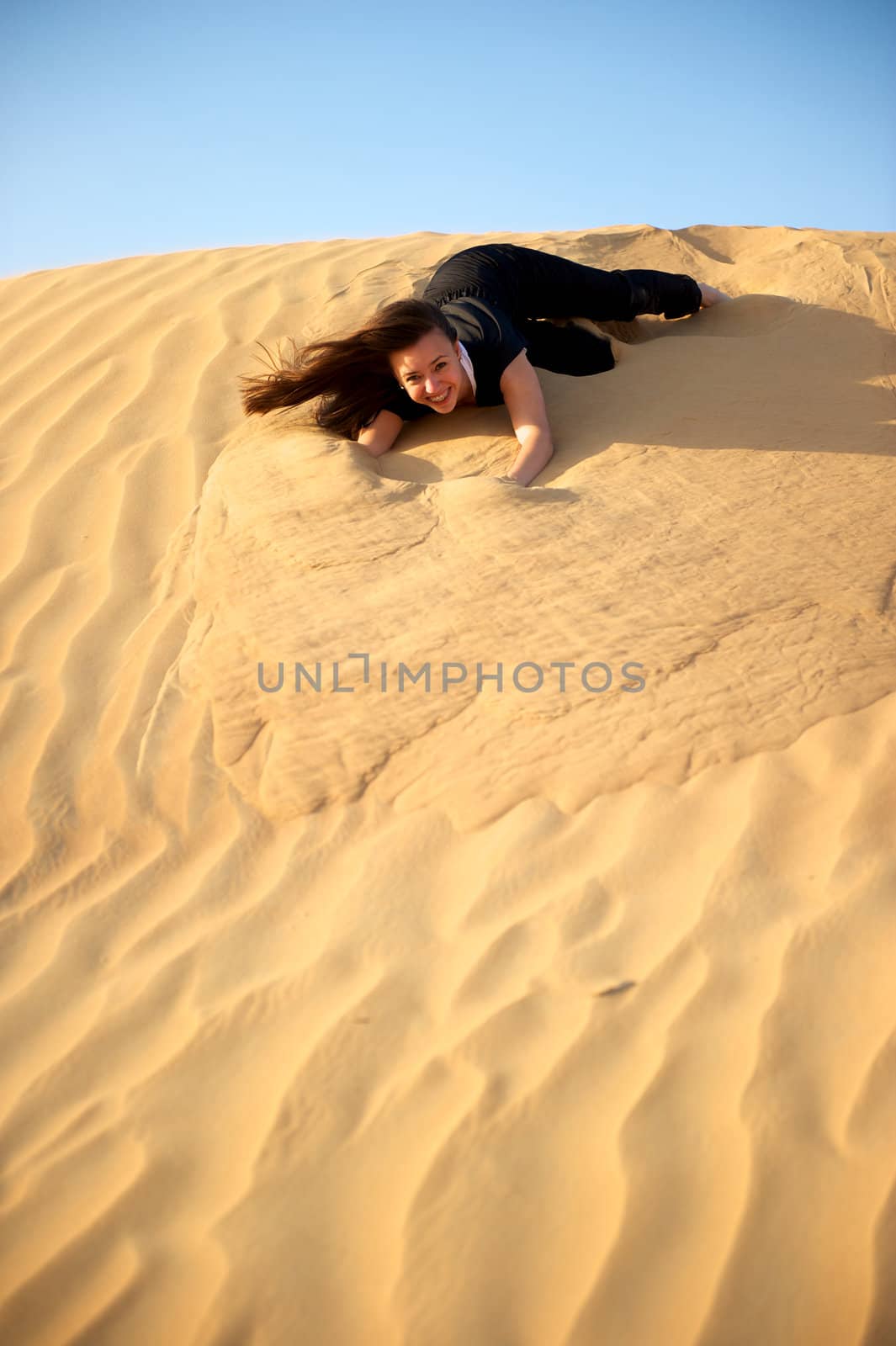 Woman enjoying the desert in Dubai, United Arab Emirates