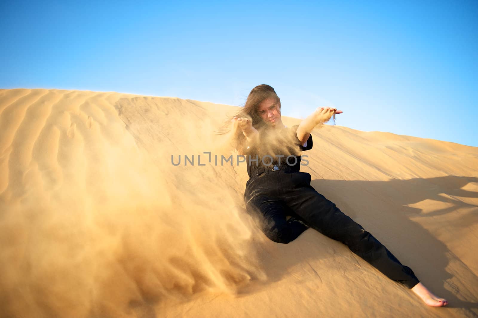 Woman enjoying the desert in Dubai, United Arab Emirates