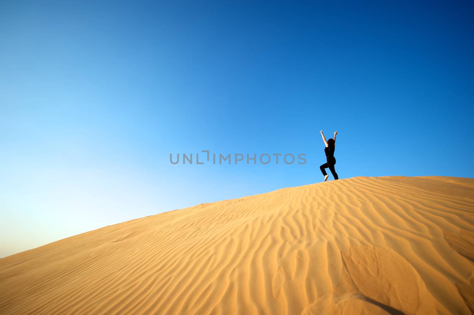 Woman enjoying the desert in Dubai, United Arab Emirates