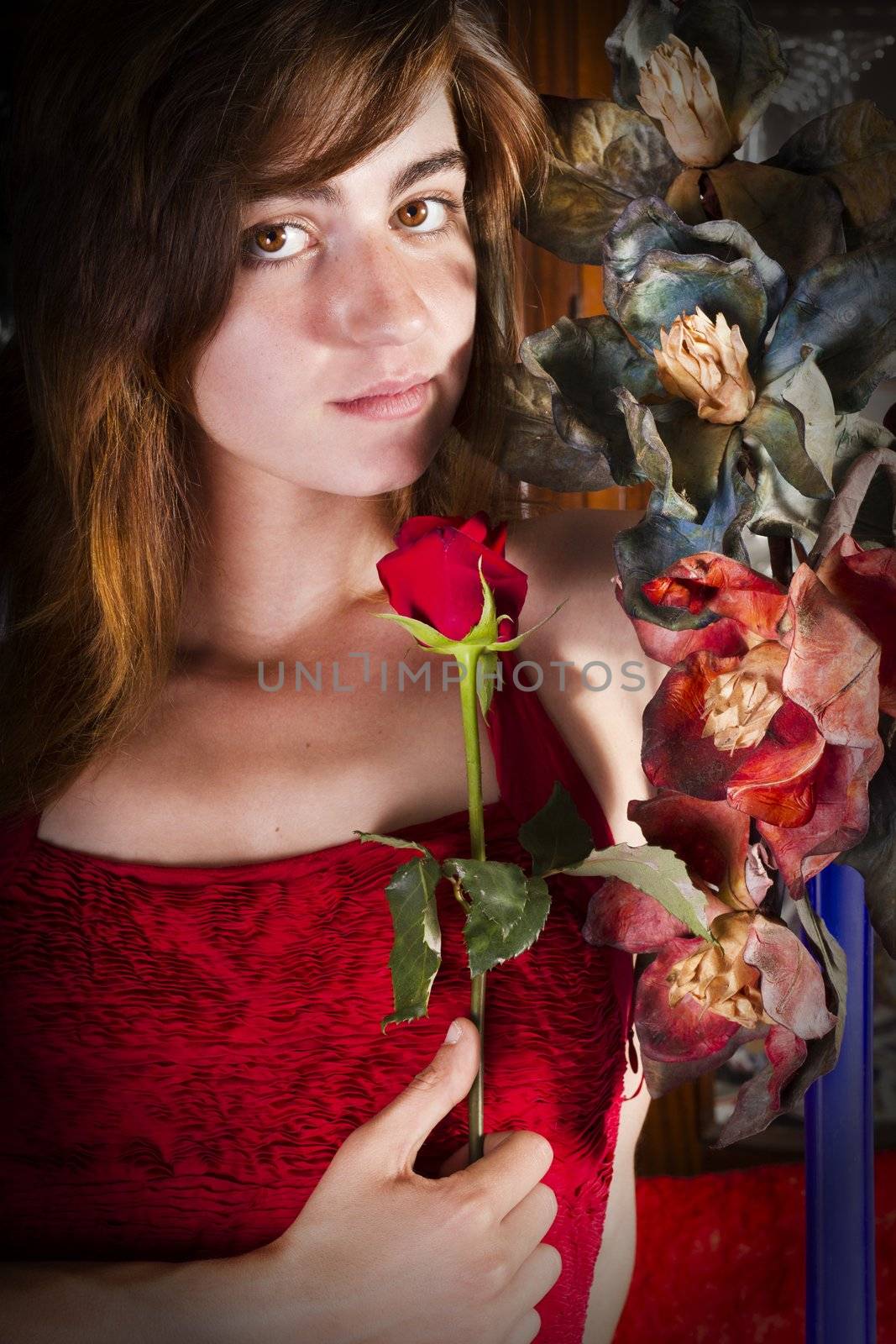 View of a beautiful young girl in a red dress on a living room.