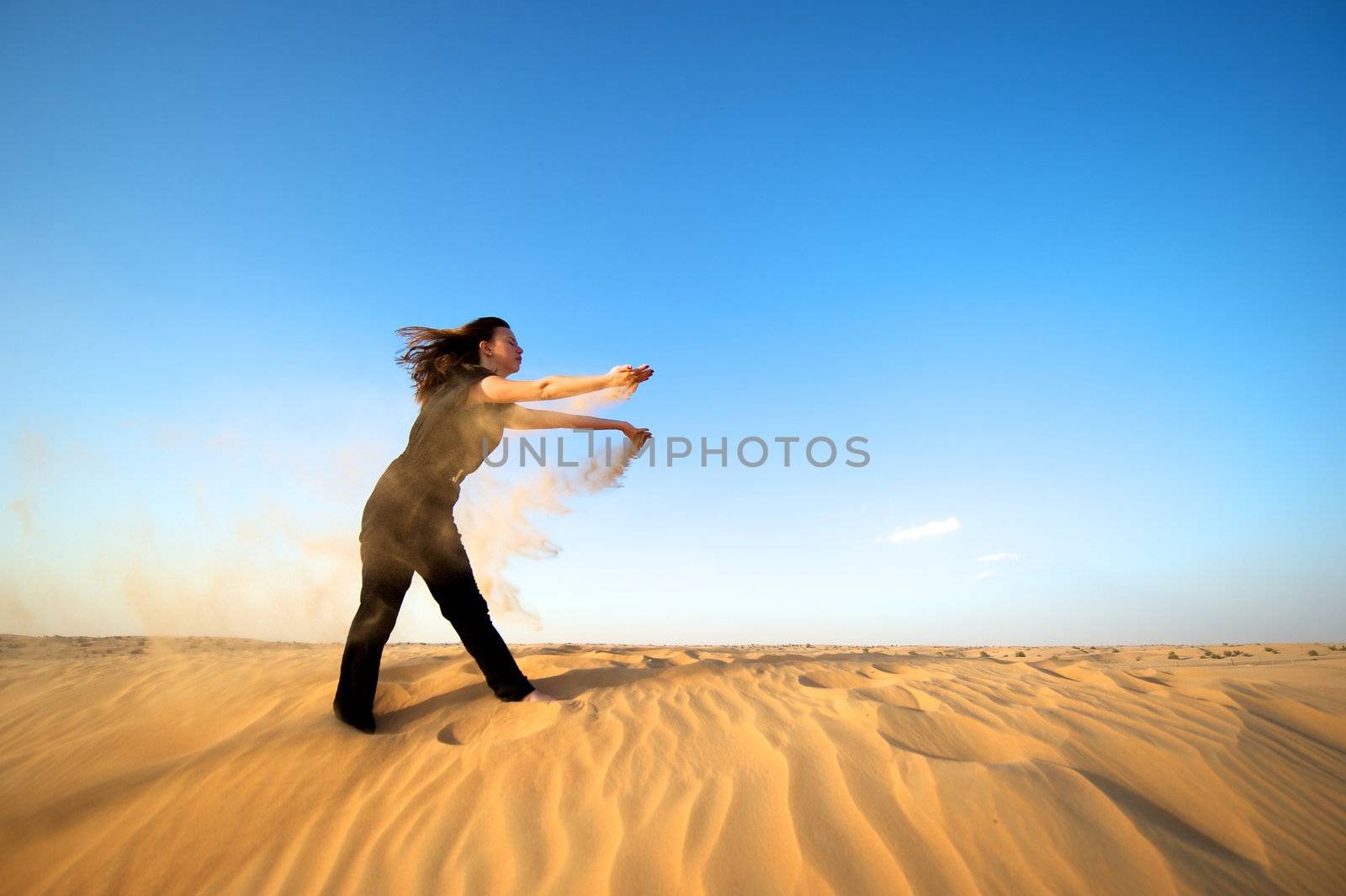 Woman enjoying the desert in Dubai, United Arab Emirates