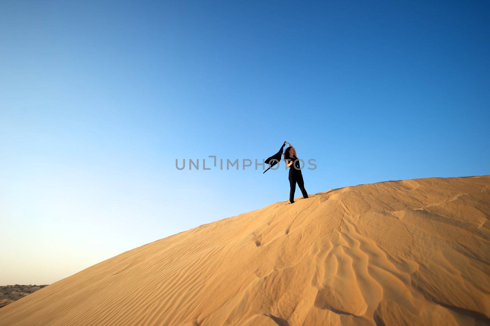 Woman enjoying the desert in Dubai, United Arab Emirates