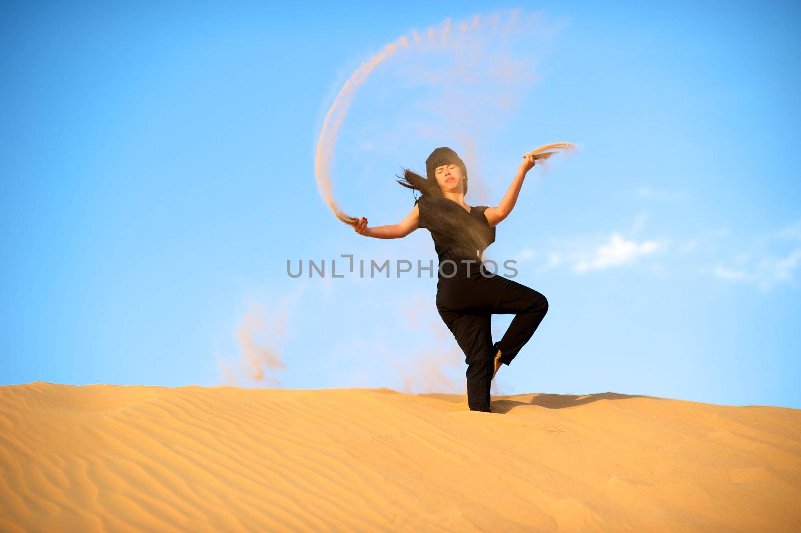 Woman enjoying the desert in Dubai, United Arab Emirates