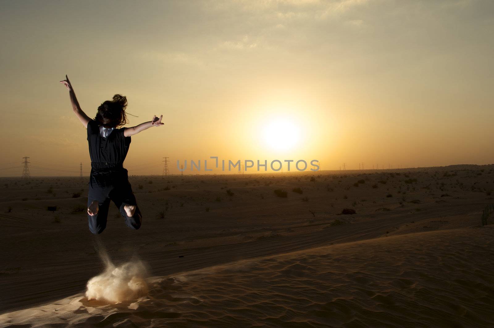 Woman enjoying the desert in Dubai, United Arab Emirates