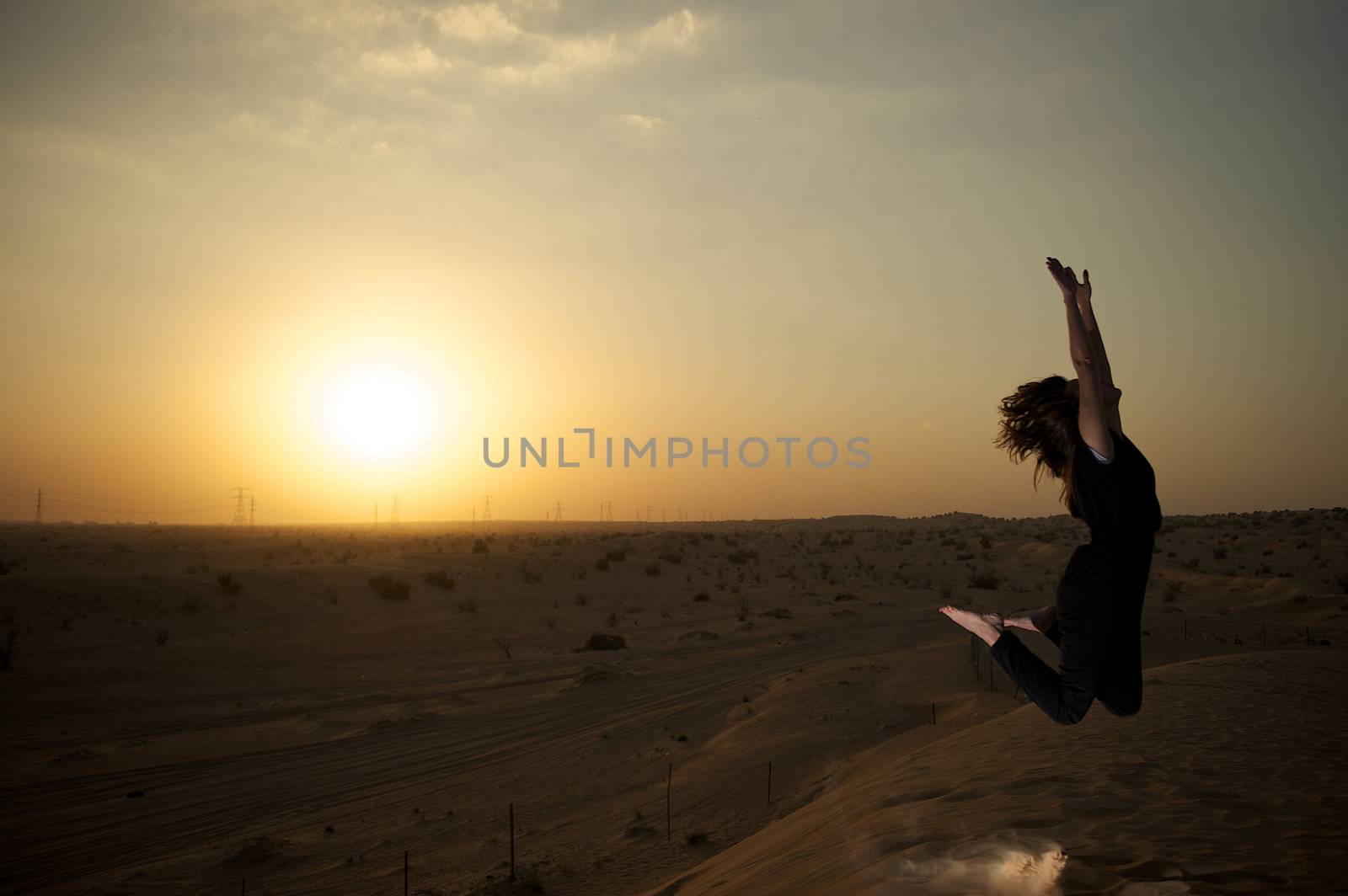 Woman enjoying the desert in Dubai, United Arab Emirates