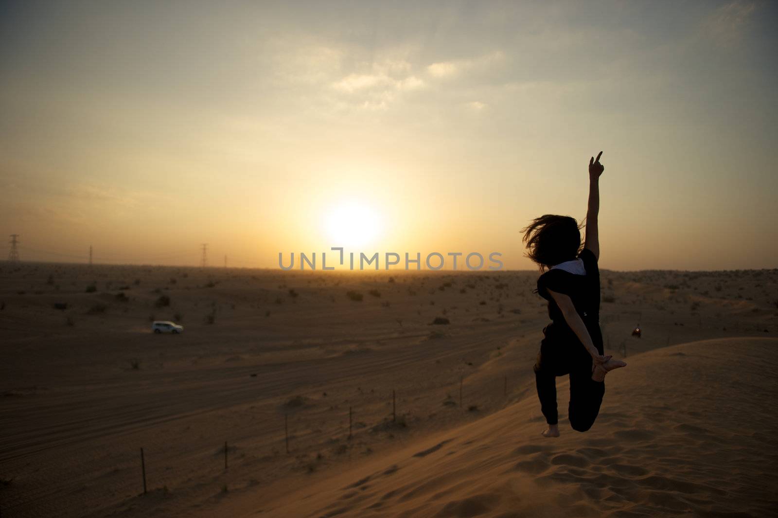 Woman enjoying the desert in Dubai, United Arab Emirates