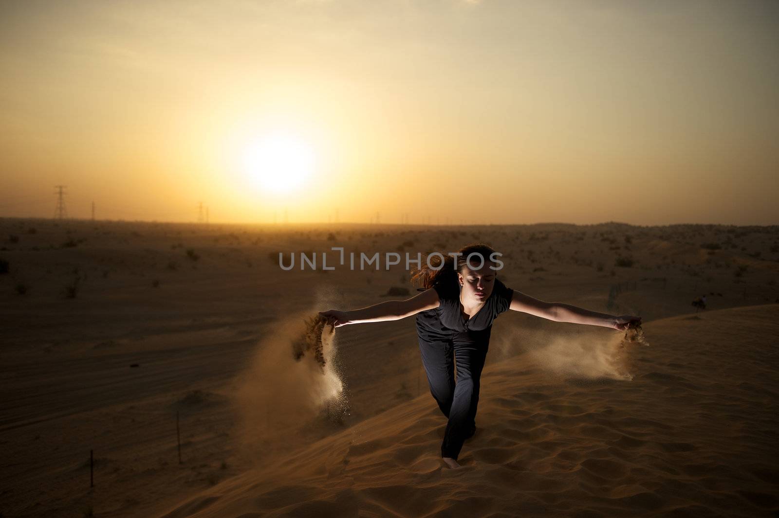 Woman enjoying the desert in Dubai, United Arab Emirates