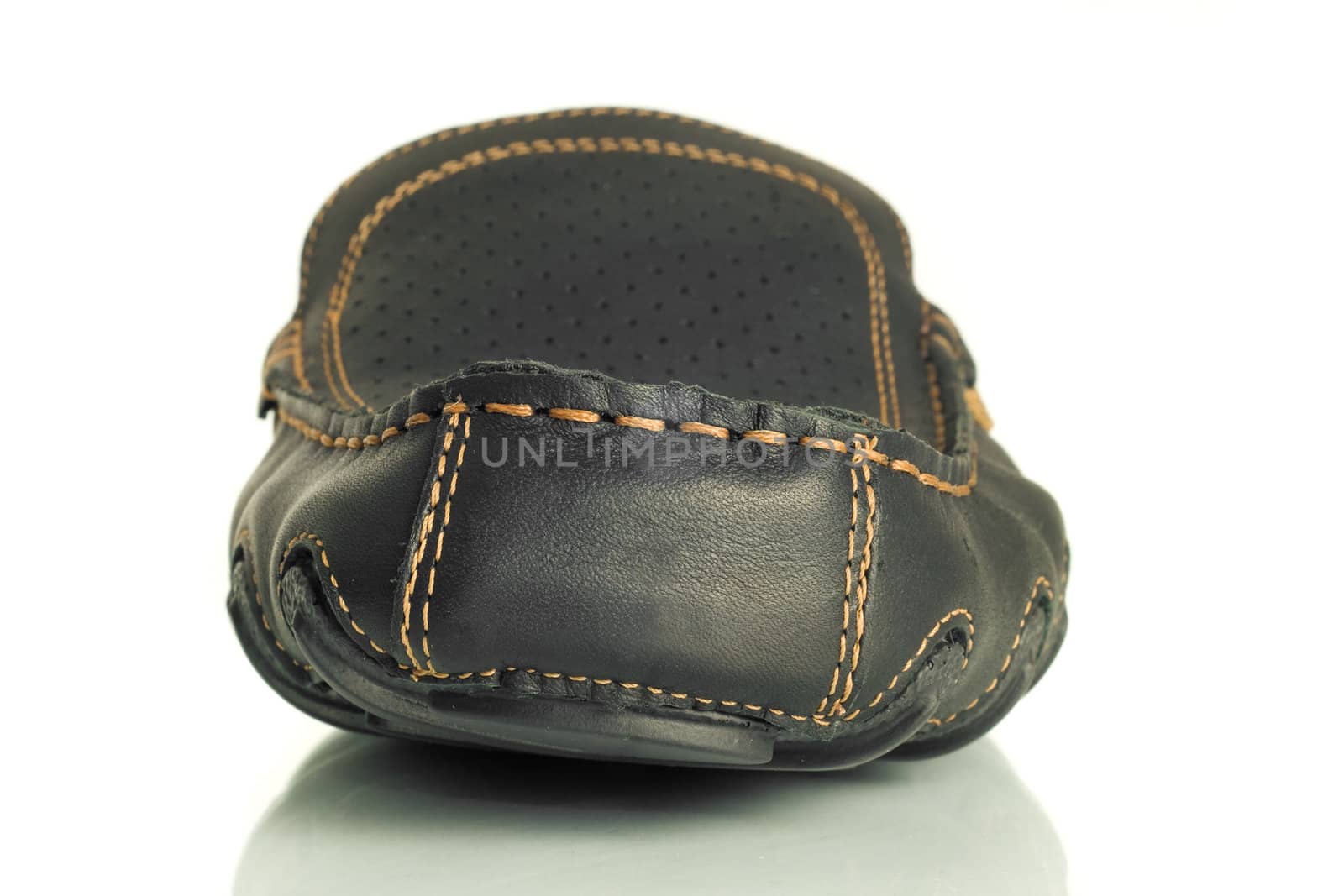 Close-up of single black mens moccasin by Arsgera