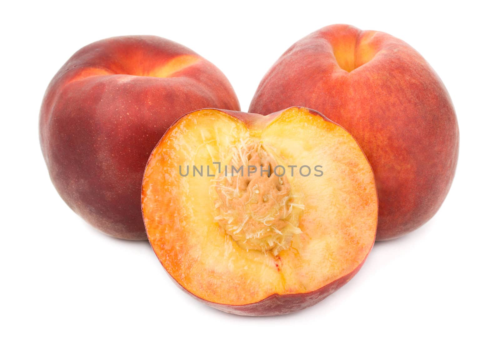 close-up heap of ripe peaches, isolated on white