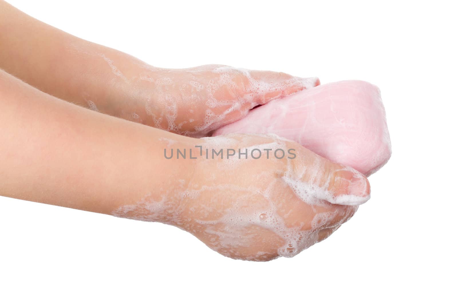 toilet soap in child's hands, isolated on white