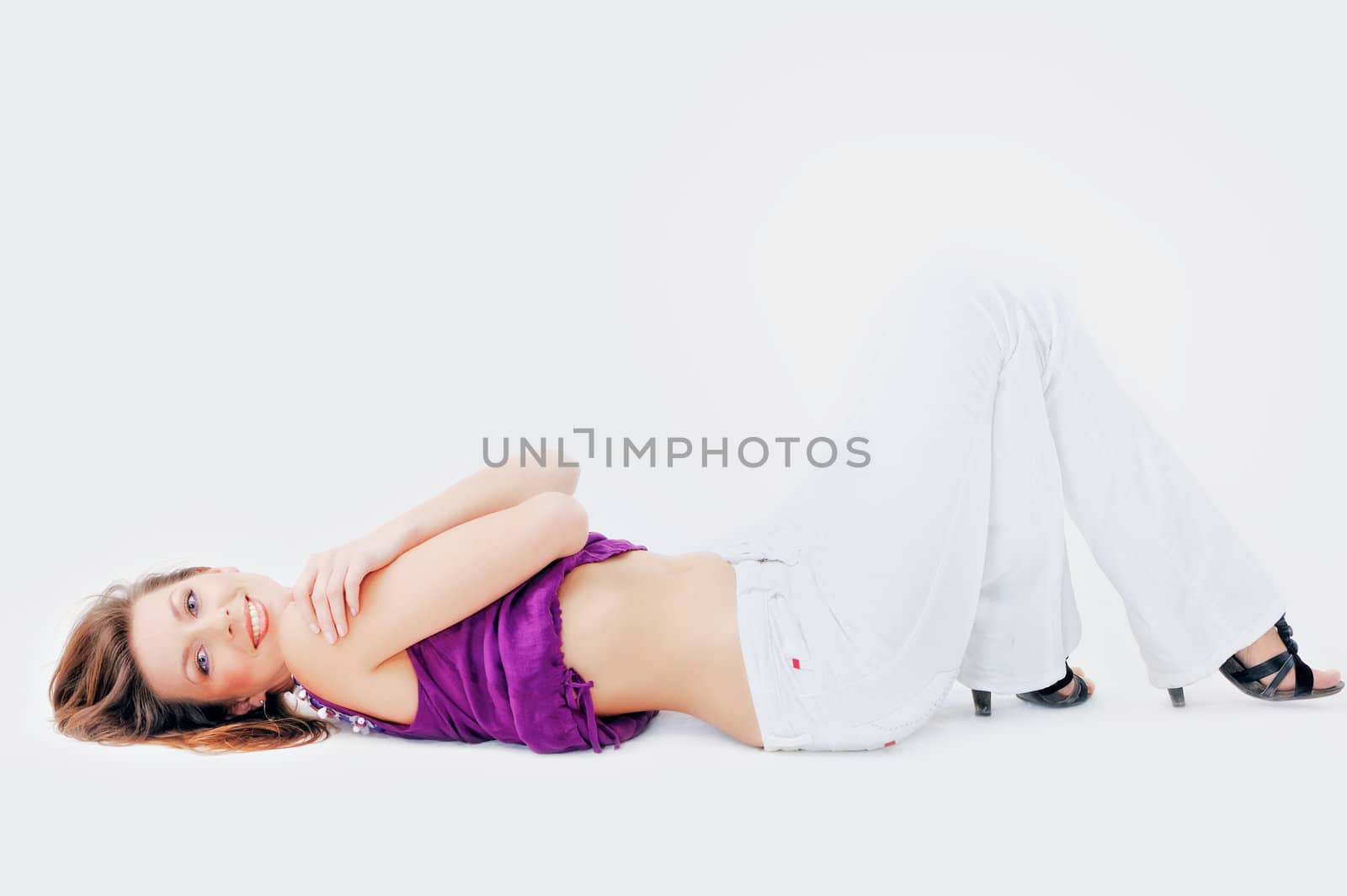 Young woman resting supine. Isolated on white background