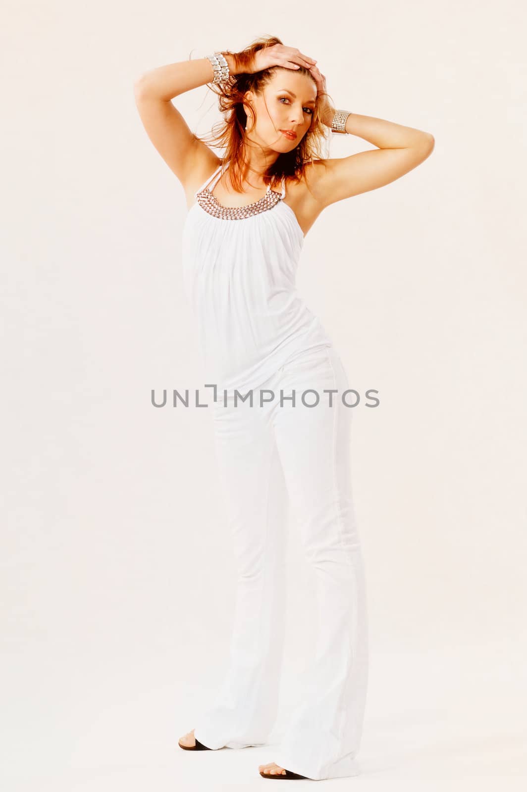 A beautiful woman in white. Isolated on light background