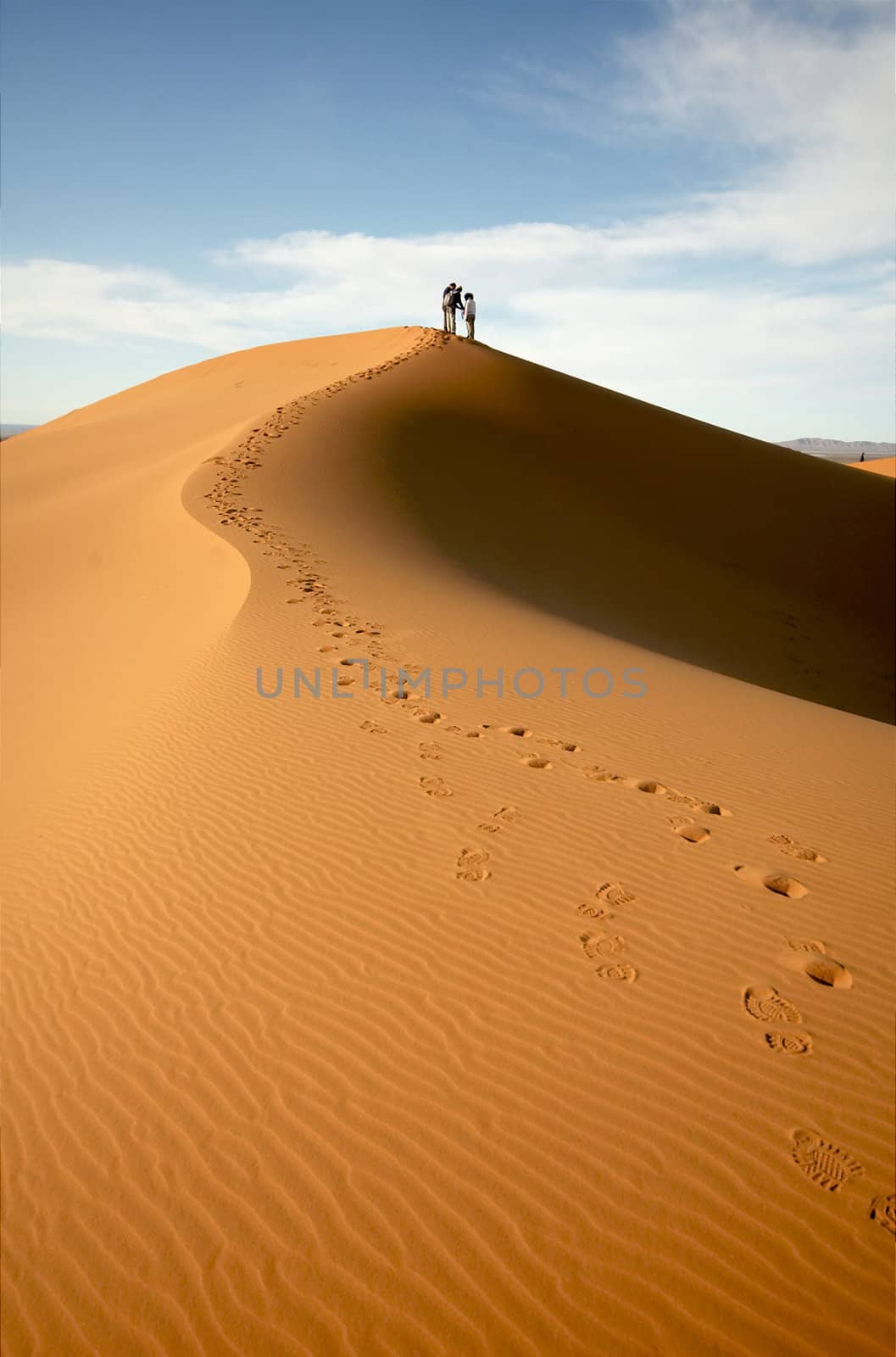 People at the dunes of the Moroccan Sahara