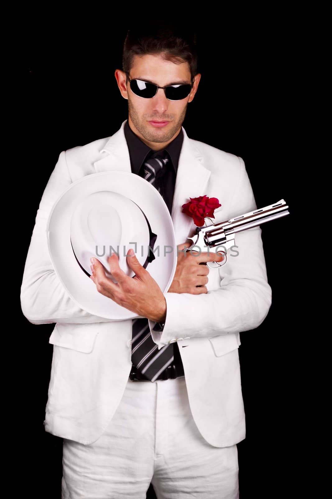 View of a white suit gangster man holding a gun.