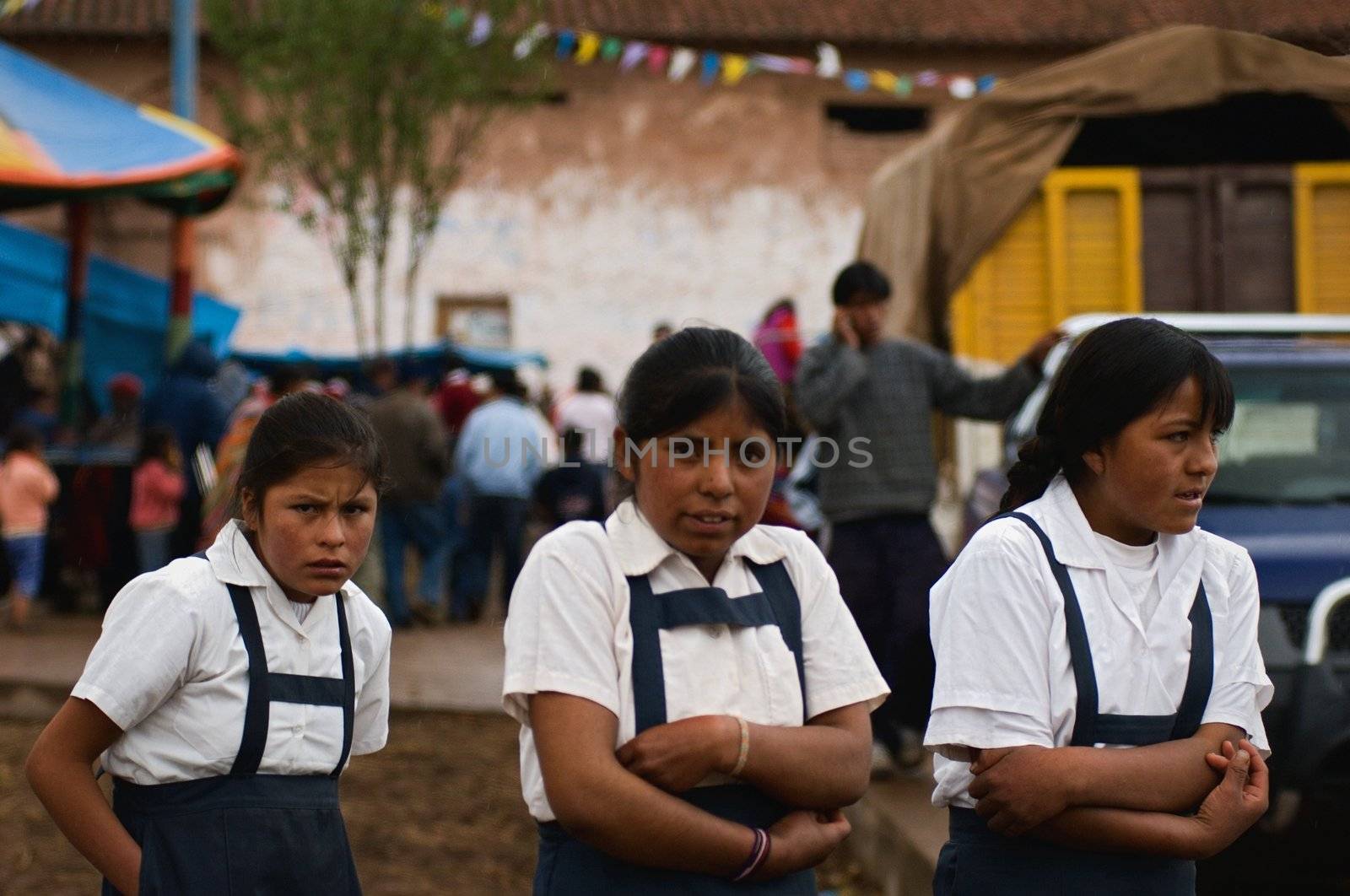 PERU SOUTH AMERICA 2008 JANUARY 2: A portrait of three Peruvian schoolgirls in one high-mountainous small village in the Andes. The Peruvian schoolgirls have come on the rural area to the day off. Village in the Andes. On January 2nd 2008. 