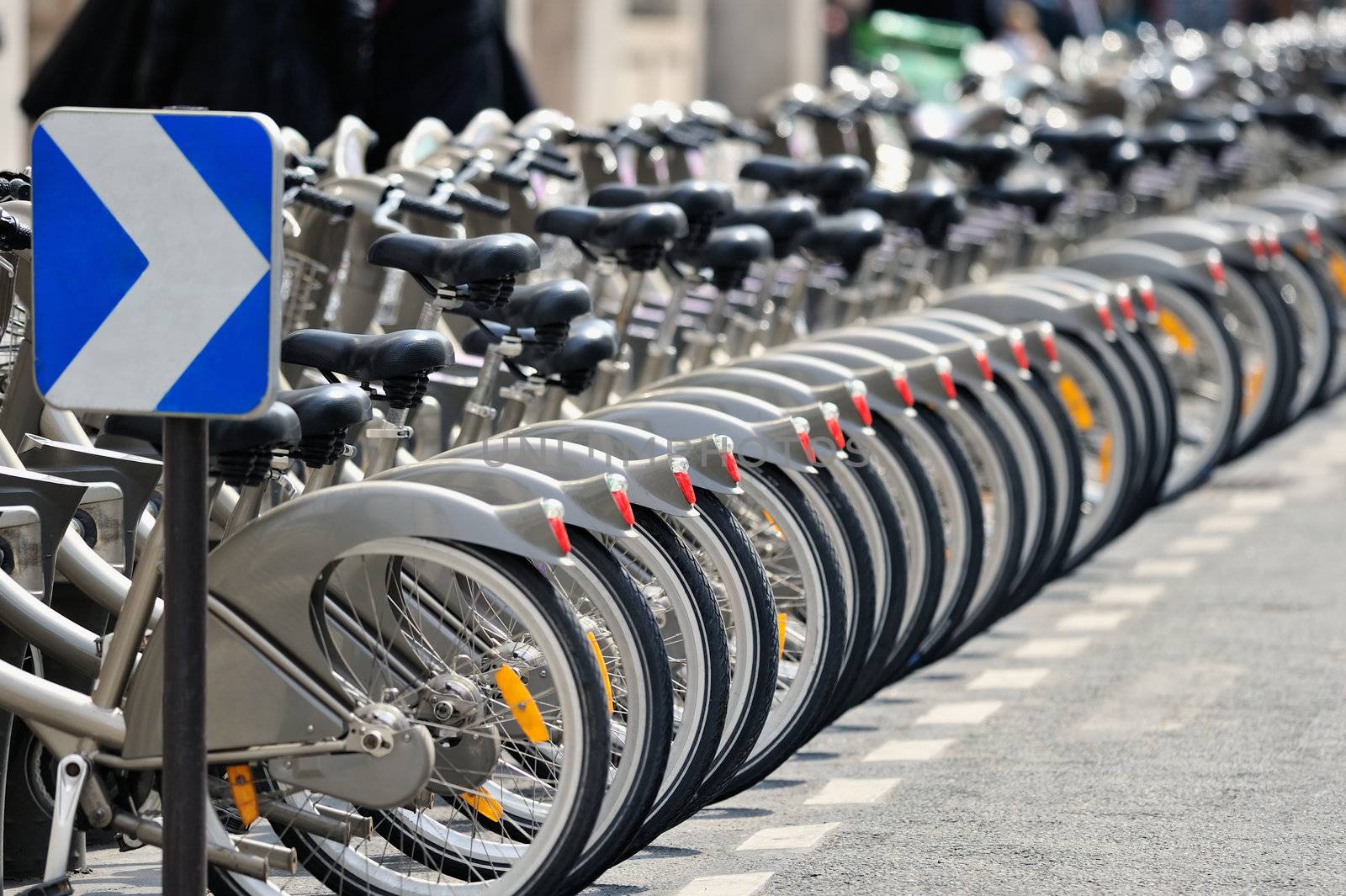 Row of bicycles on the parking. Photo with tilt-shift lens