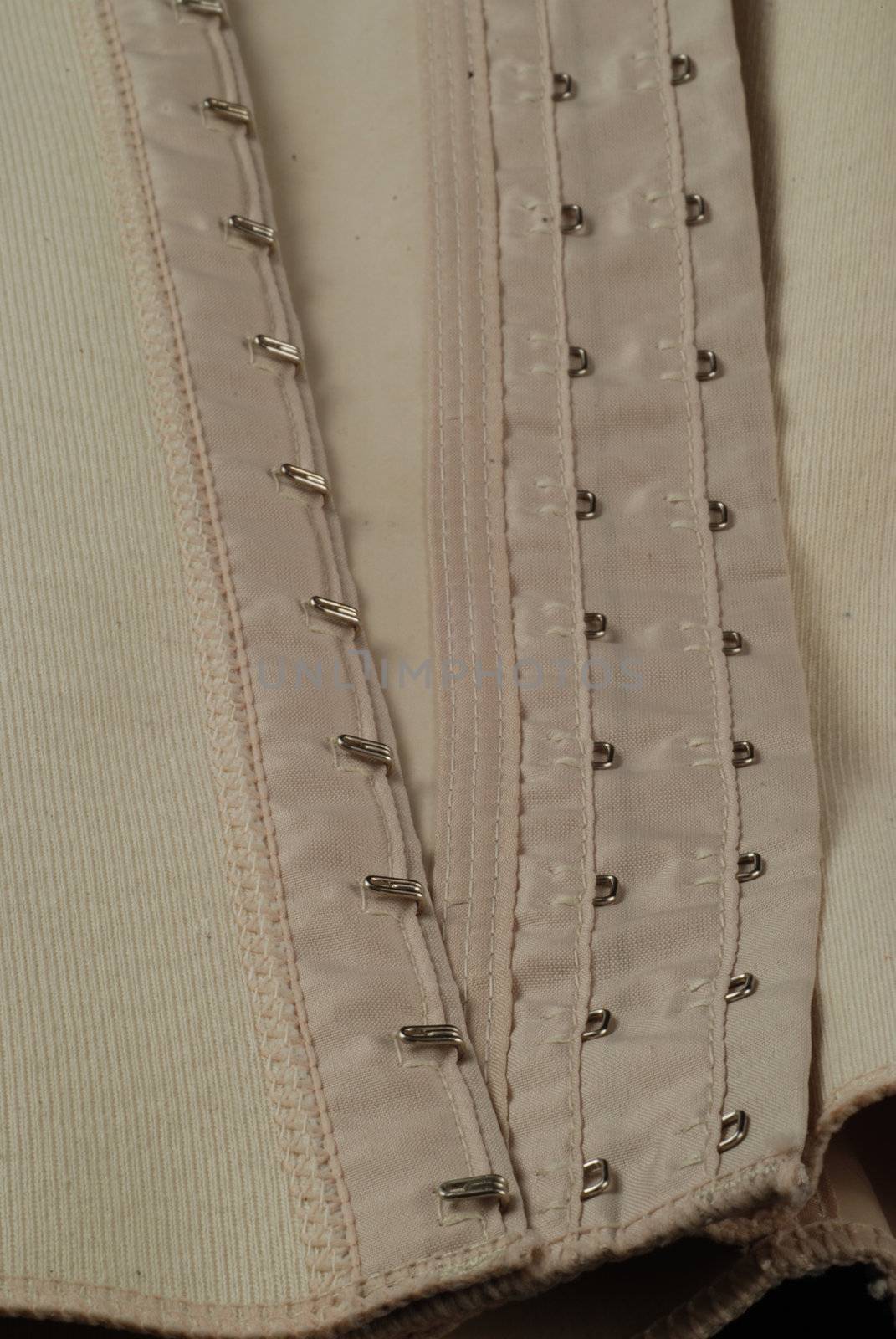 eyelets and hooks used in girdles and in corsets