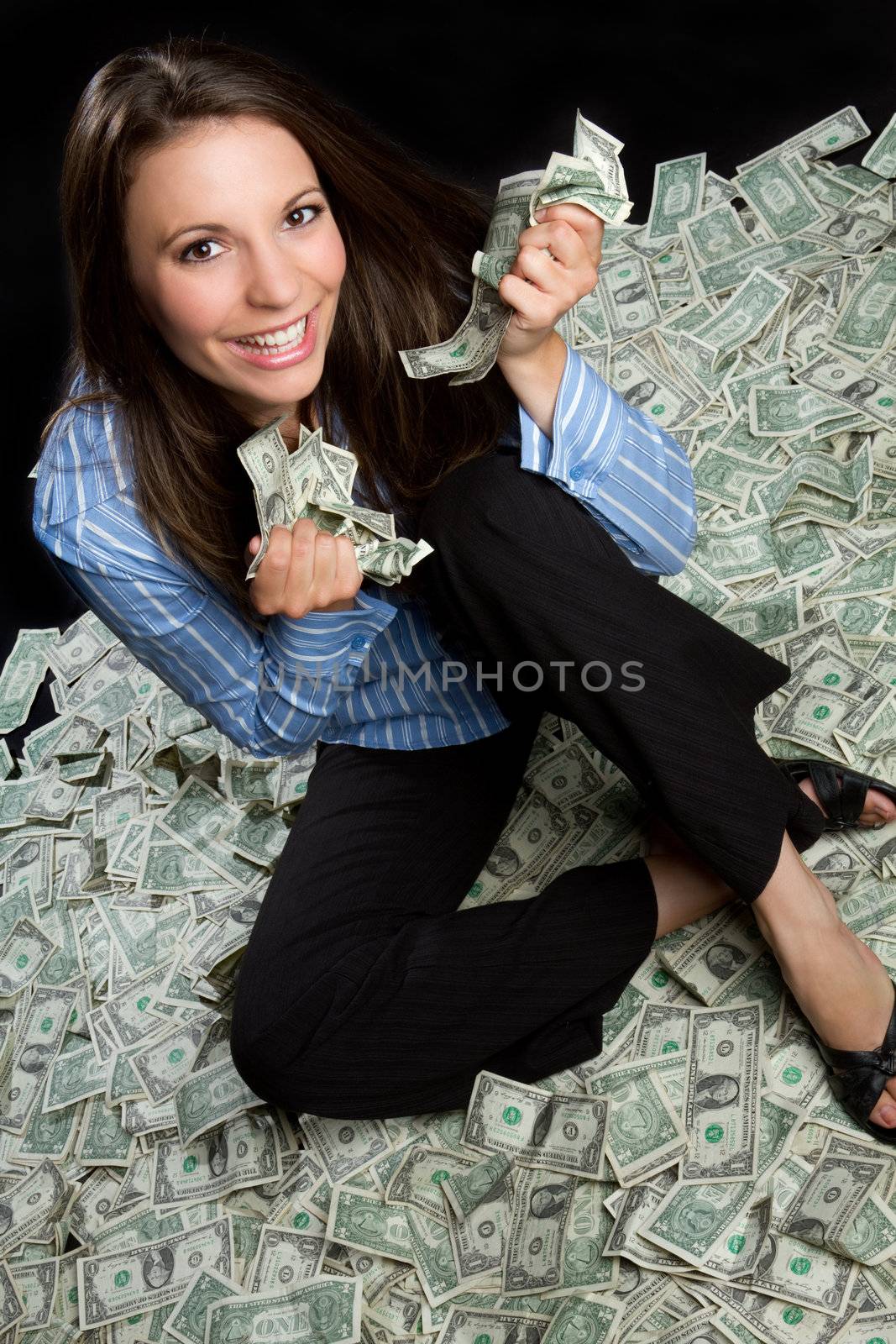 Beautiful smiling woman holding money