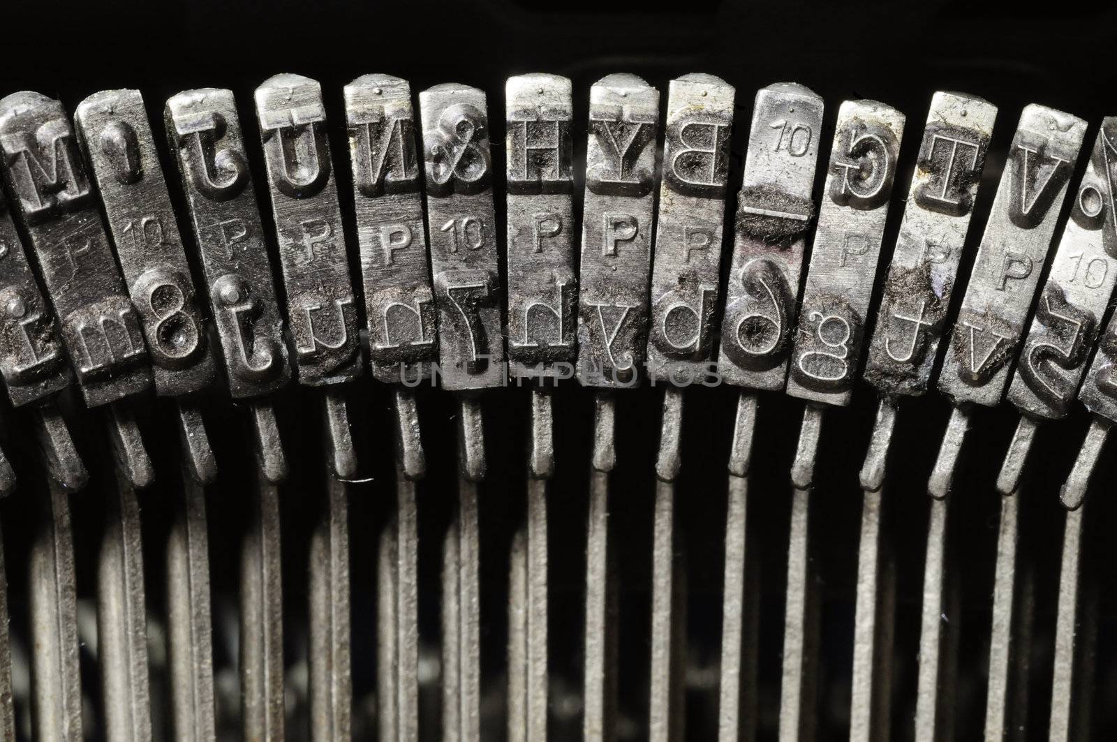 Close-up of old typewriter letter and symbol keys