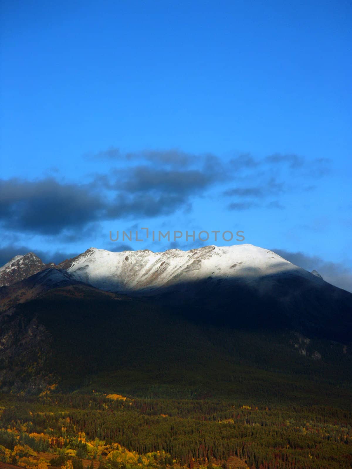 Colorado Autumn Mountains with snow in sunlight