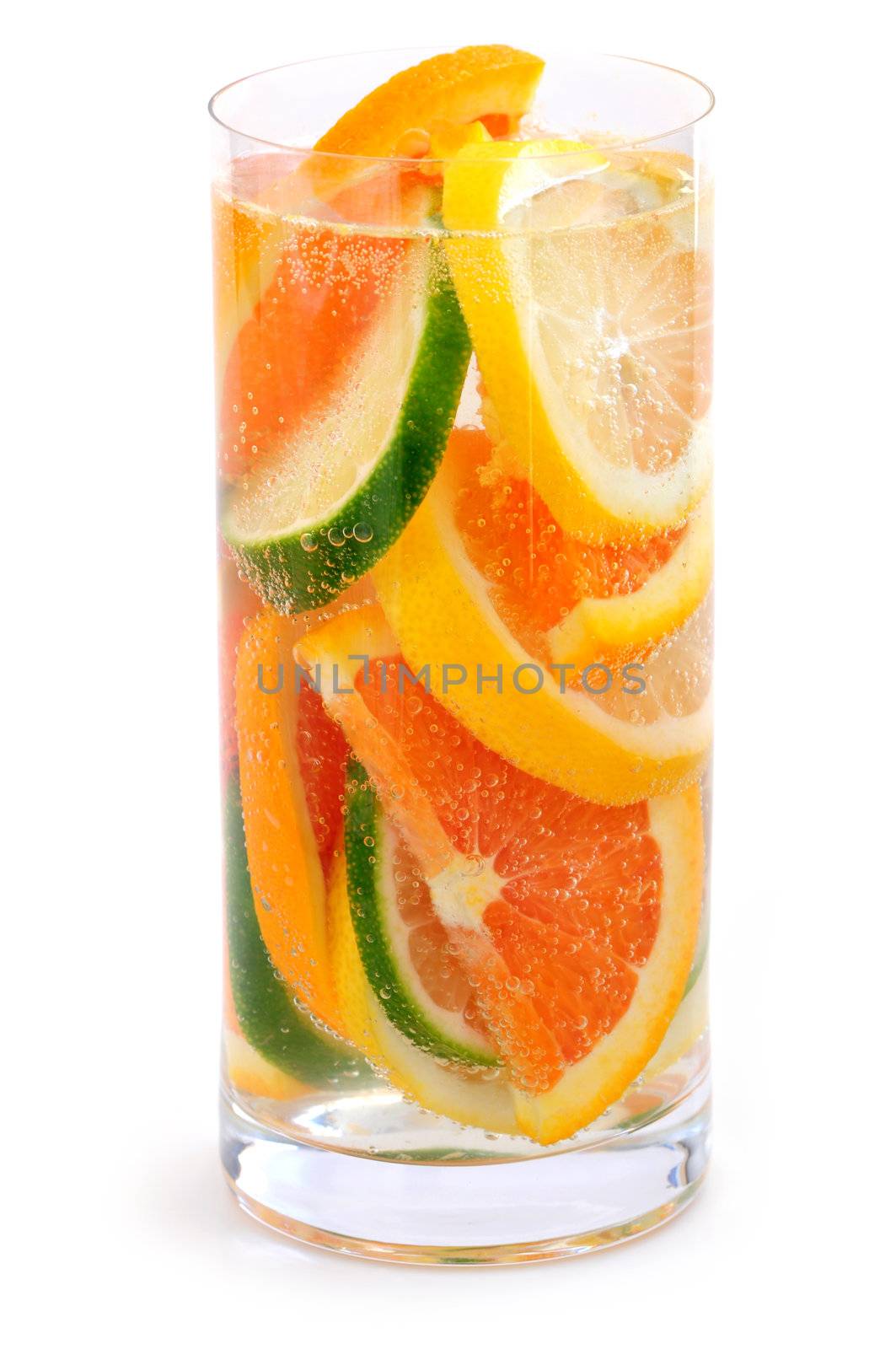 Bubbly beverage with citrus slices isolated on white background