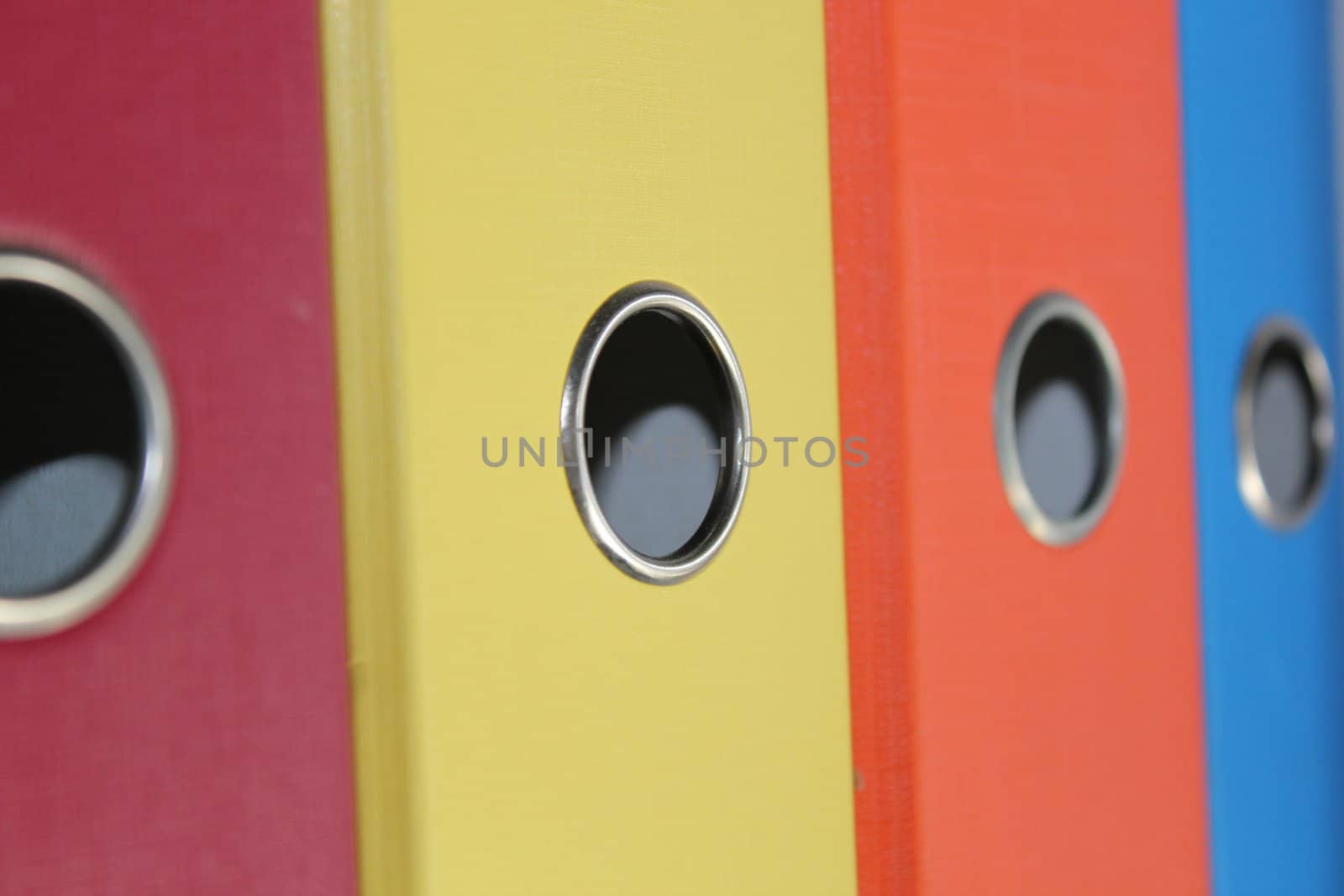 Close up of colored file folders ring