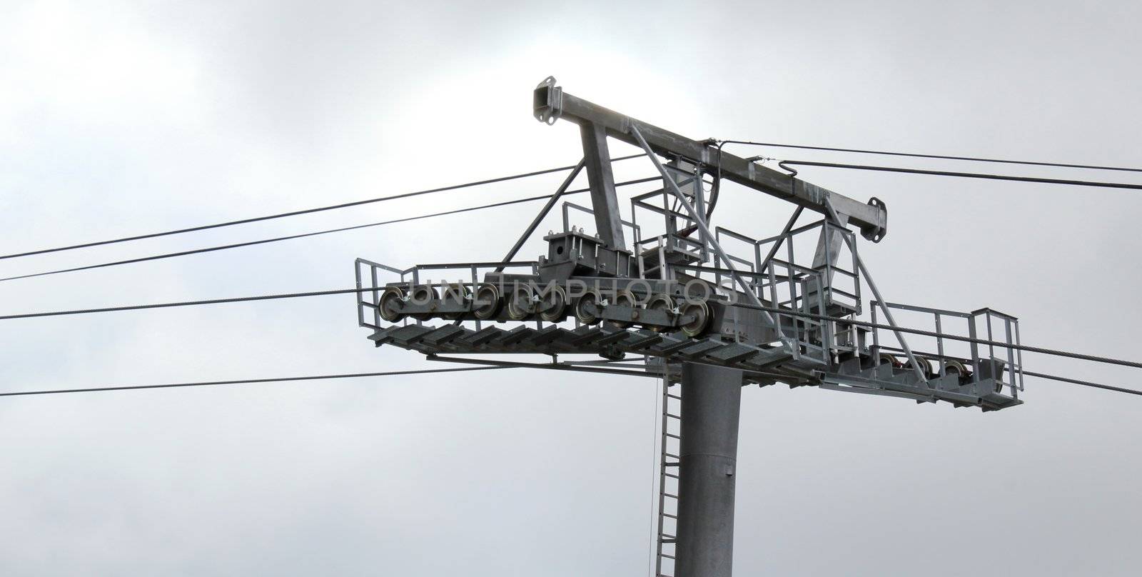 Close up of a metallic ski lift structure in the Jura mountain, France