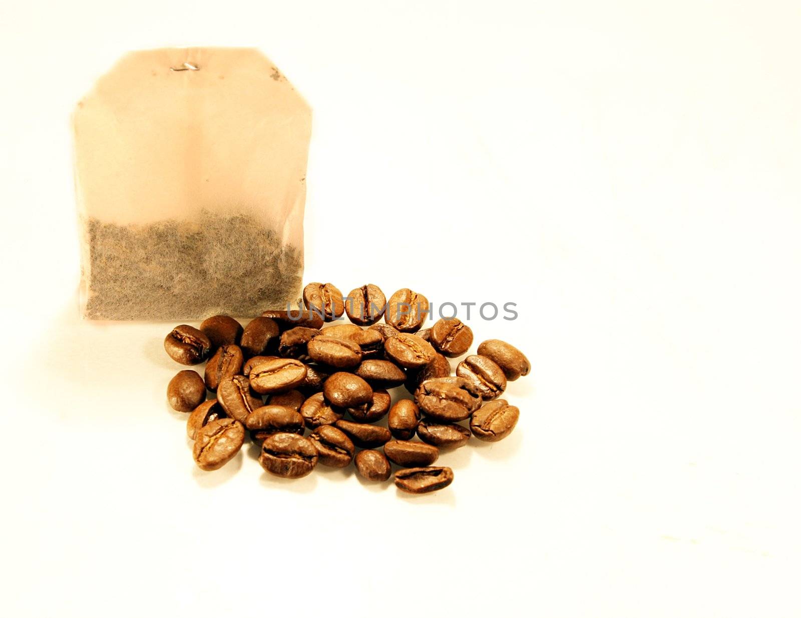 Tea bag and coffe beans isolated on white background