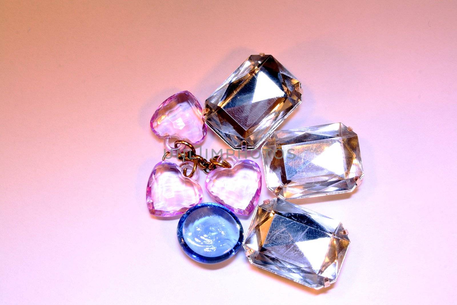 Heap of pink, blue and diamond jewelry