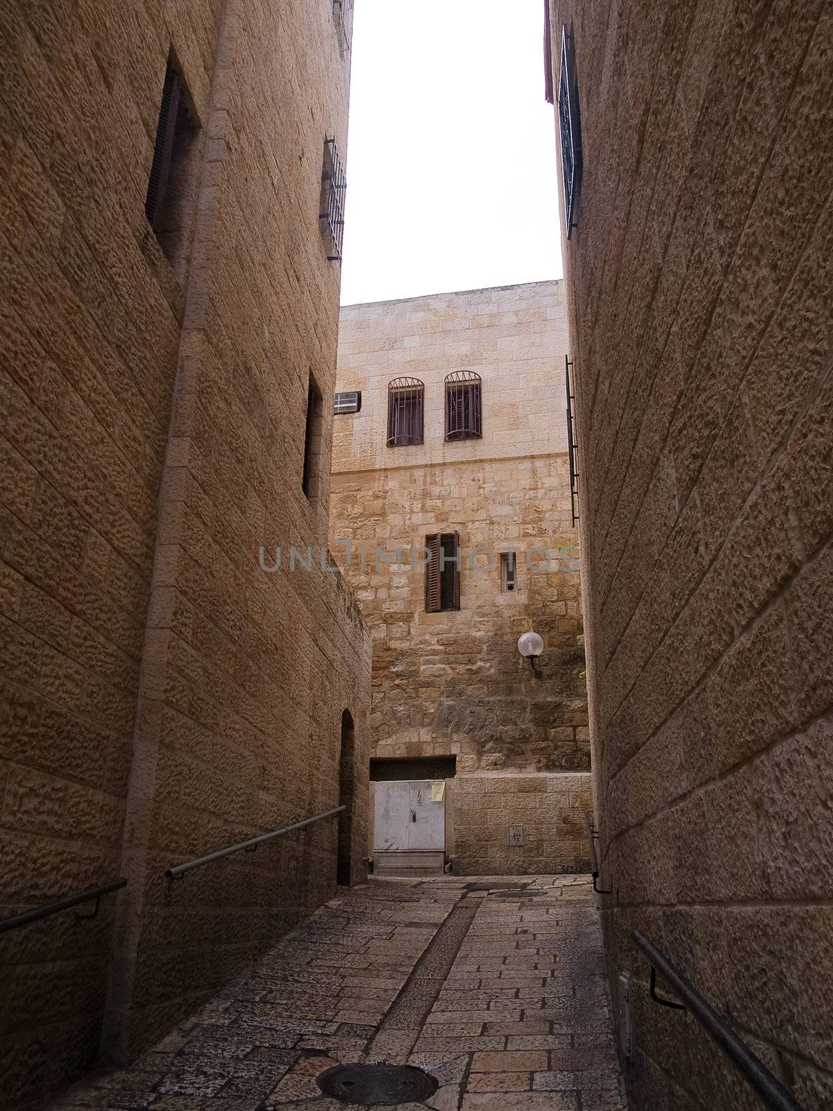 Israel - Jerusalem Old City Alley Jewish quarter made with hand curved stones vertical image