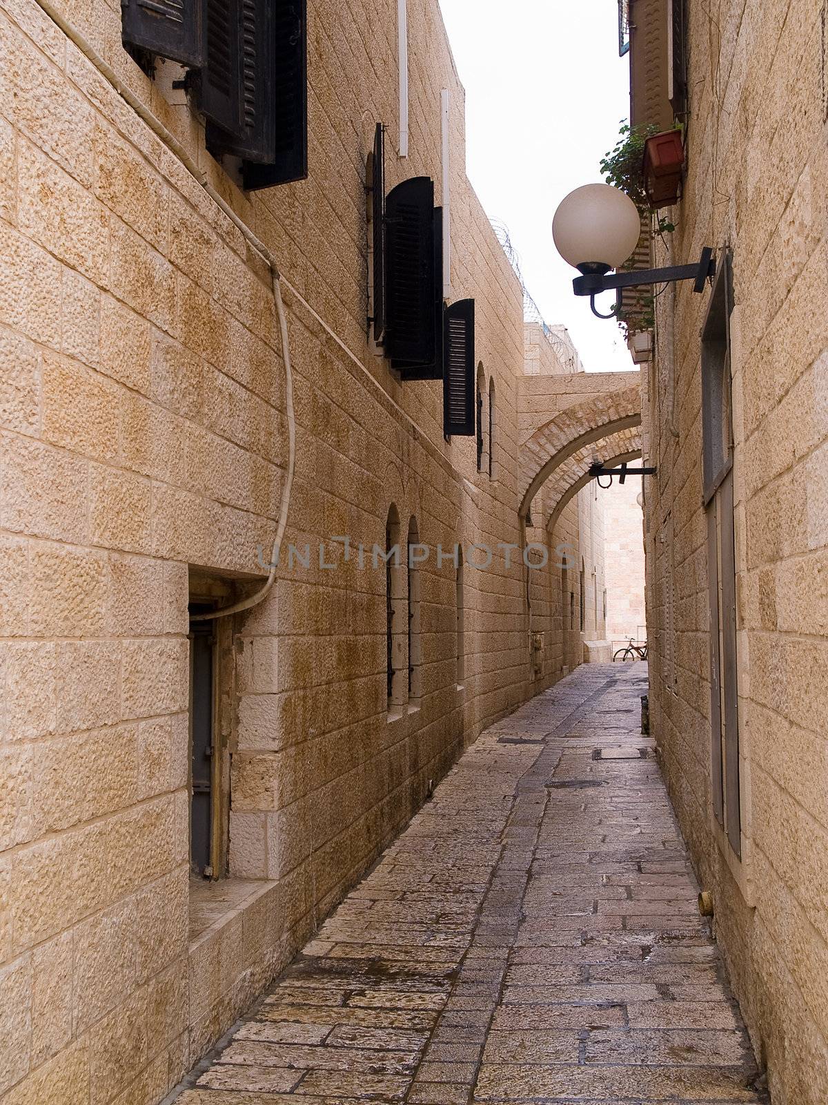 Israel - Jerusalem Old City Alley Jewish quarter made with hand curved stones vertical image