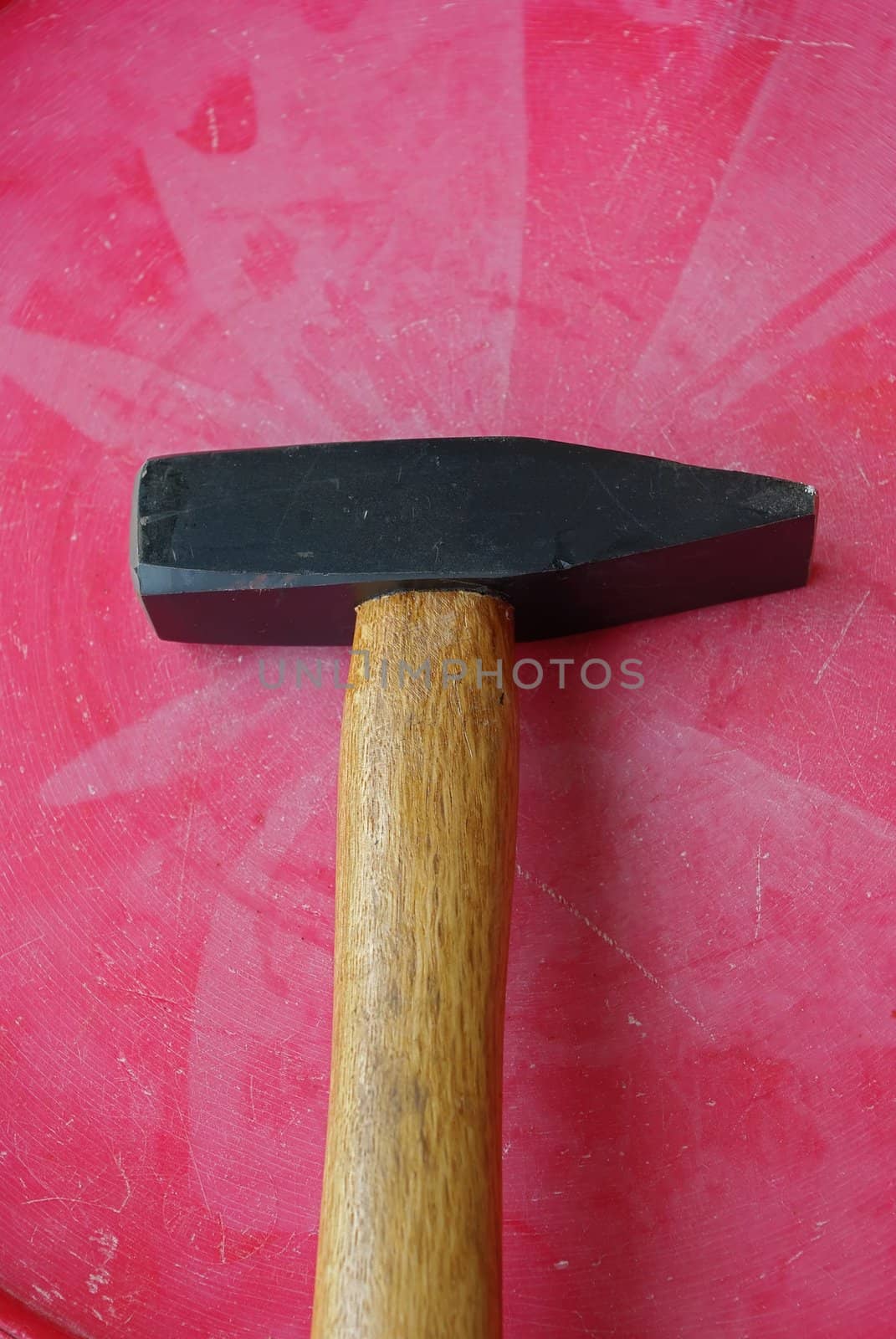 Hammer on the red background